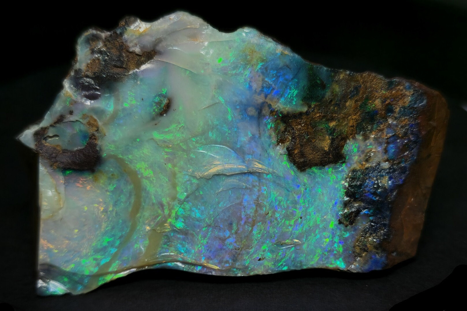 54081.0 – Australian Rough Boulder Opal specimen with the whole side covered