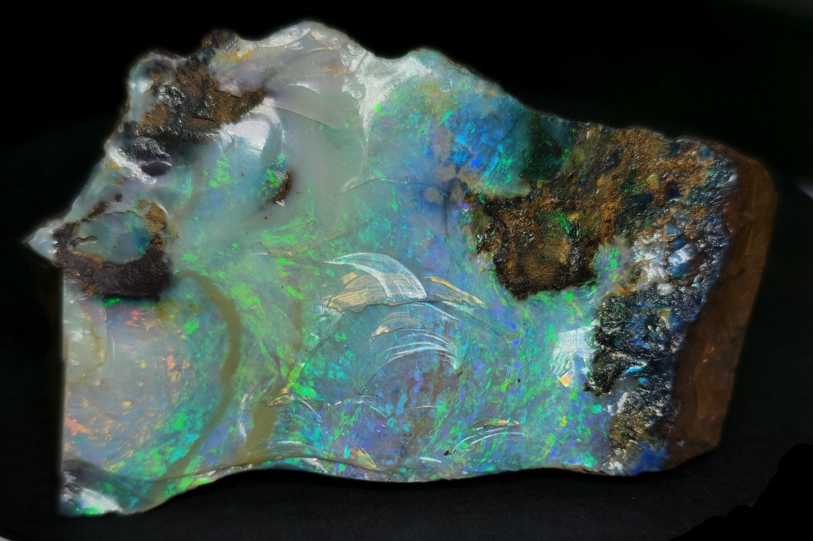 54081.0 – Australian Rough Boulder Opal specimen with the whole side covered