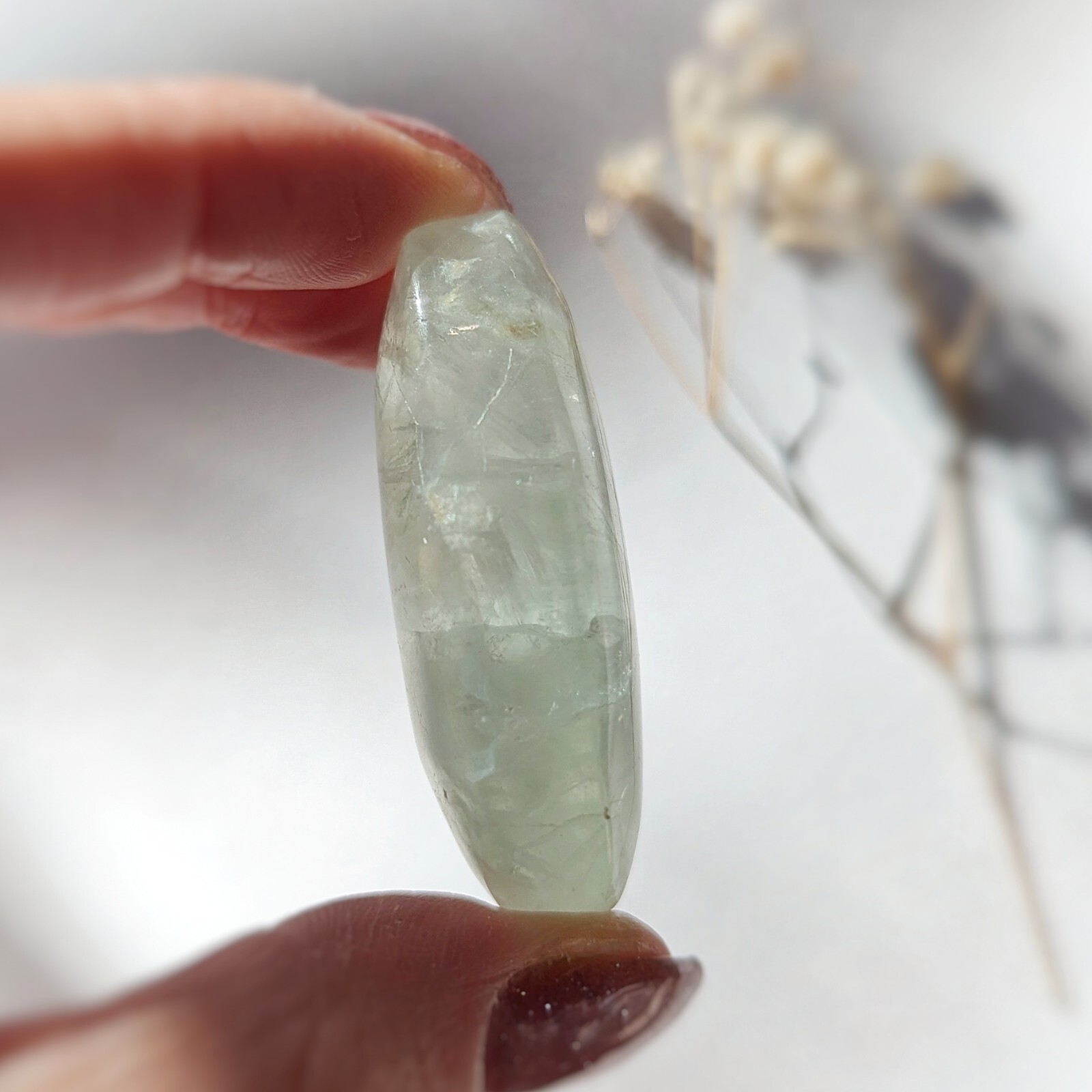 2″ ethereal mint green translucent fluorite palmstone, fluorescent fluorite