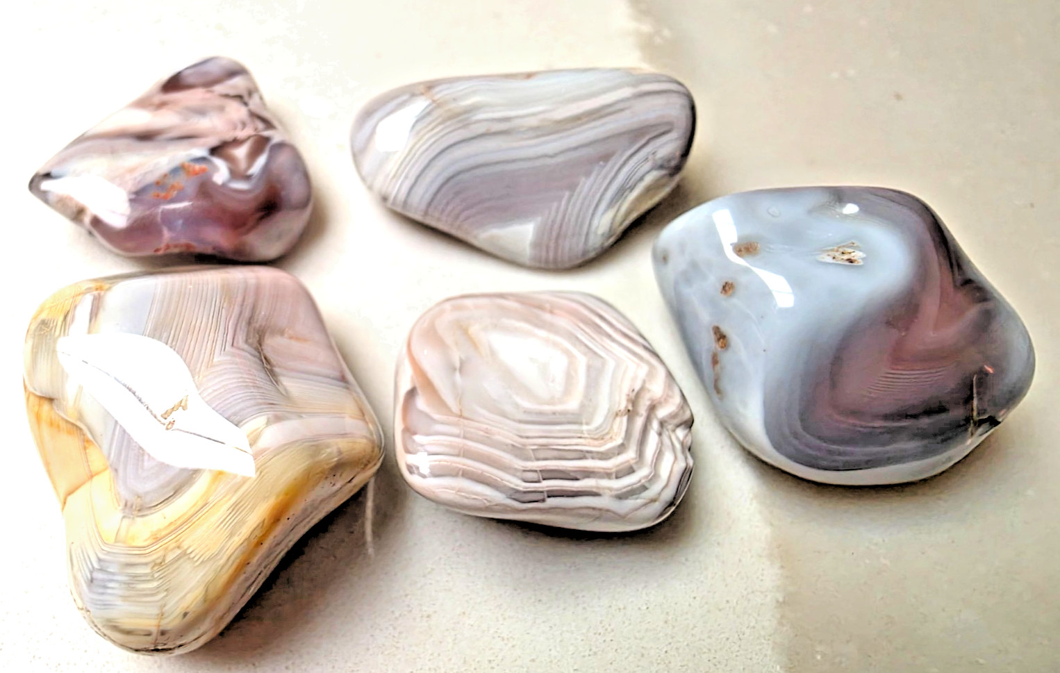 5 POLISHED BOTSWANA AGATEs , Bands , multi colors . Nice Lot 54.1 grams