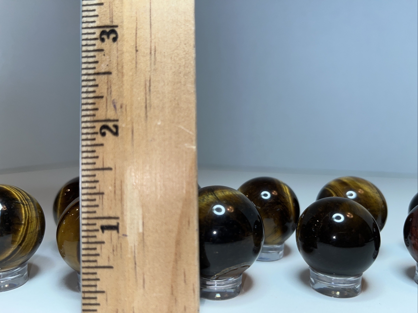 Sphere lot/tigers eye with acrylic stands.