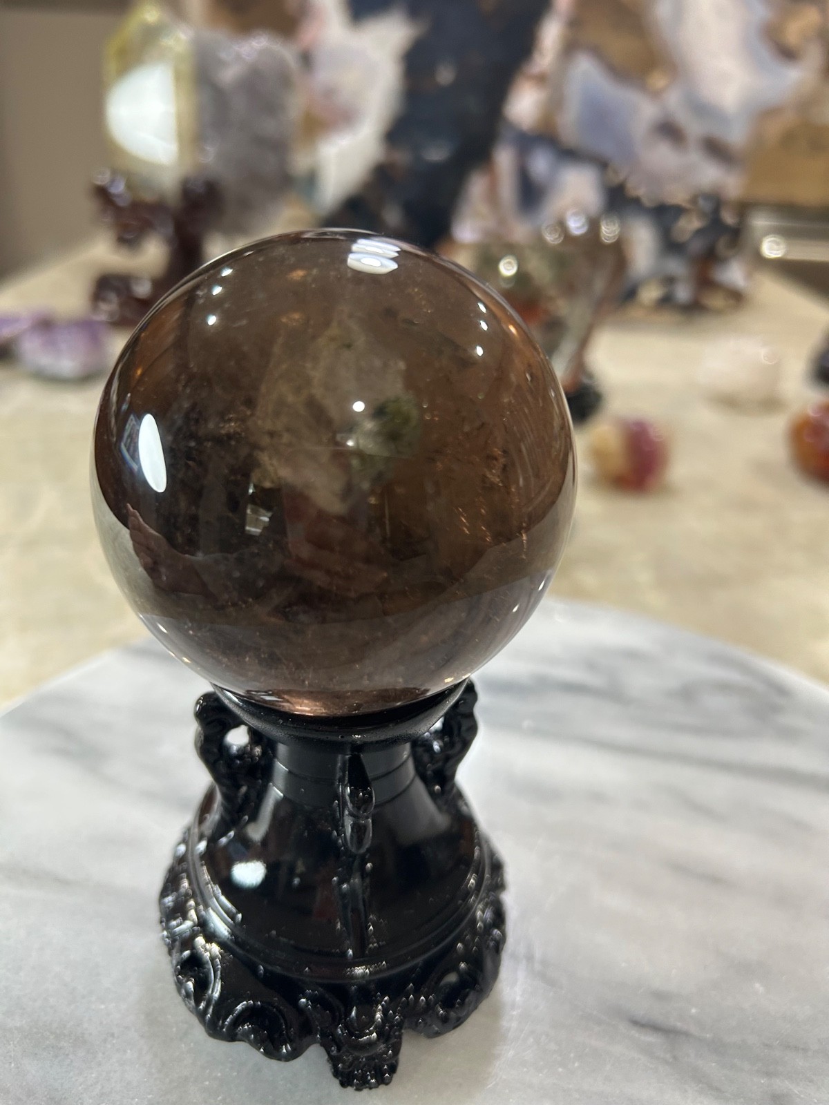Smoky quartz sphere on resin stand 2.72”
