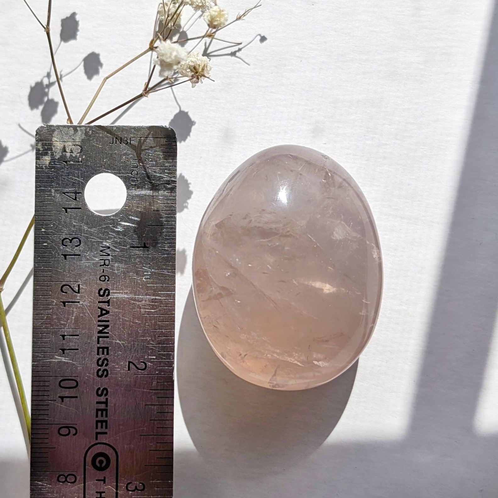 2″ translucent rose quartz palmstone with rainbow and asterism, star rose quartz