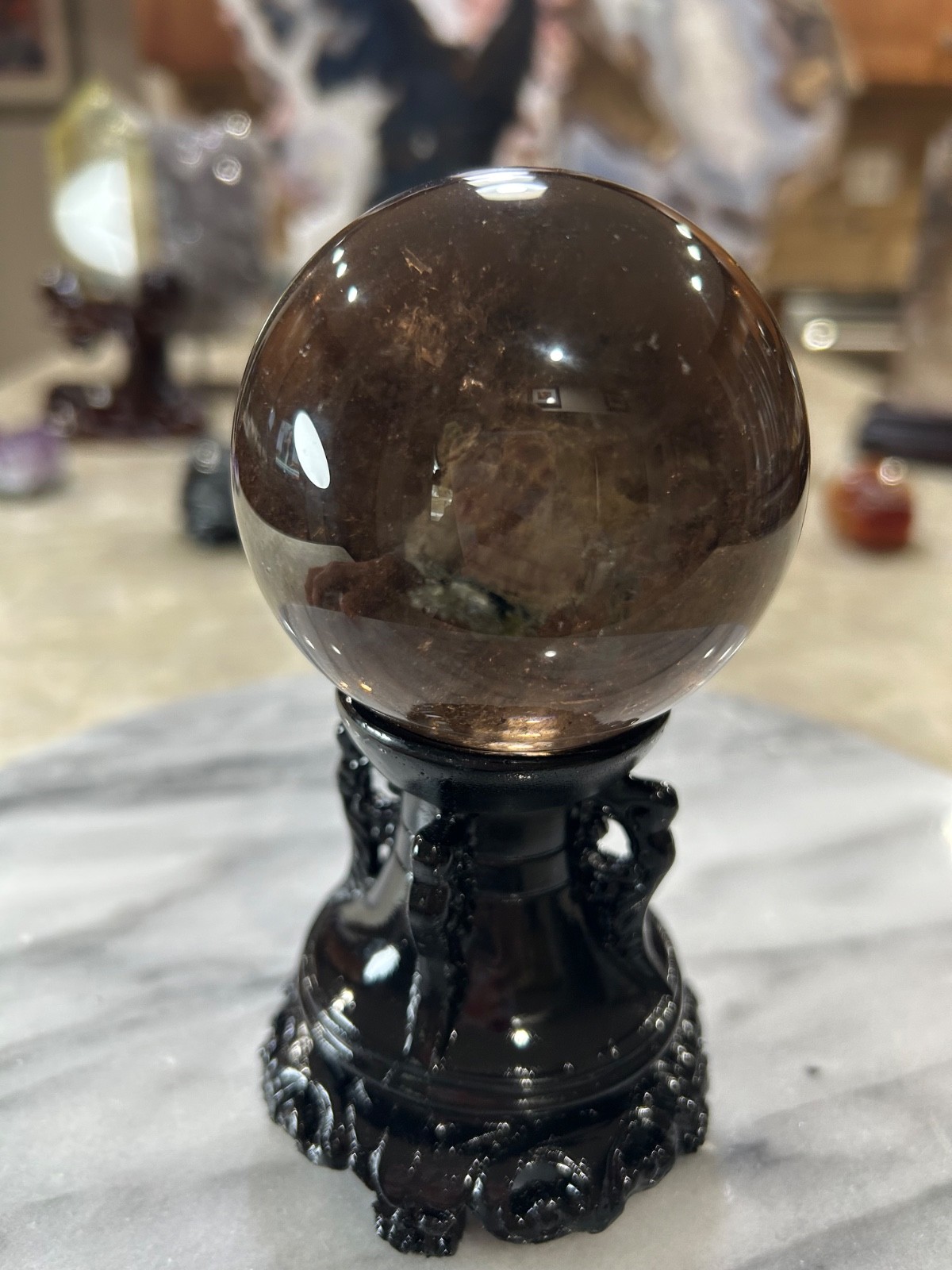 Smoky quartz sphere on resin stand 2.72”