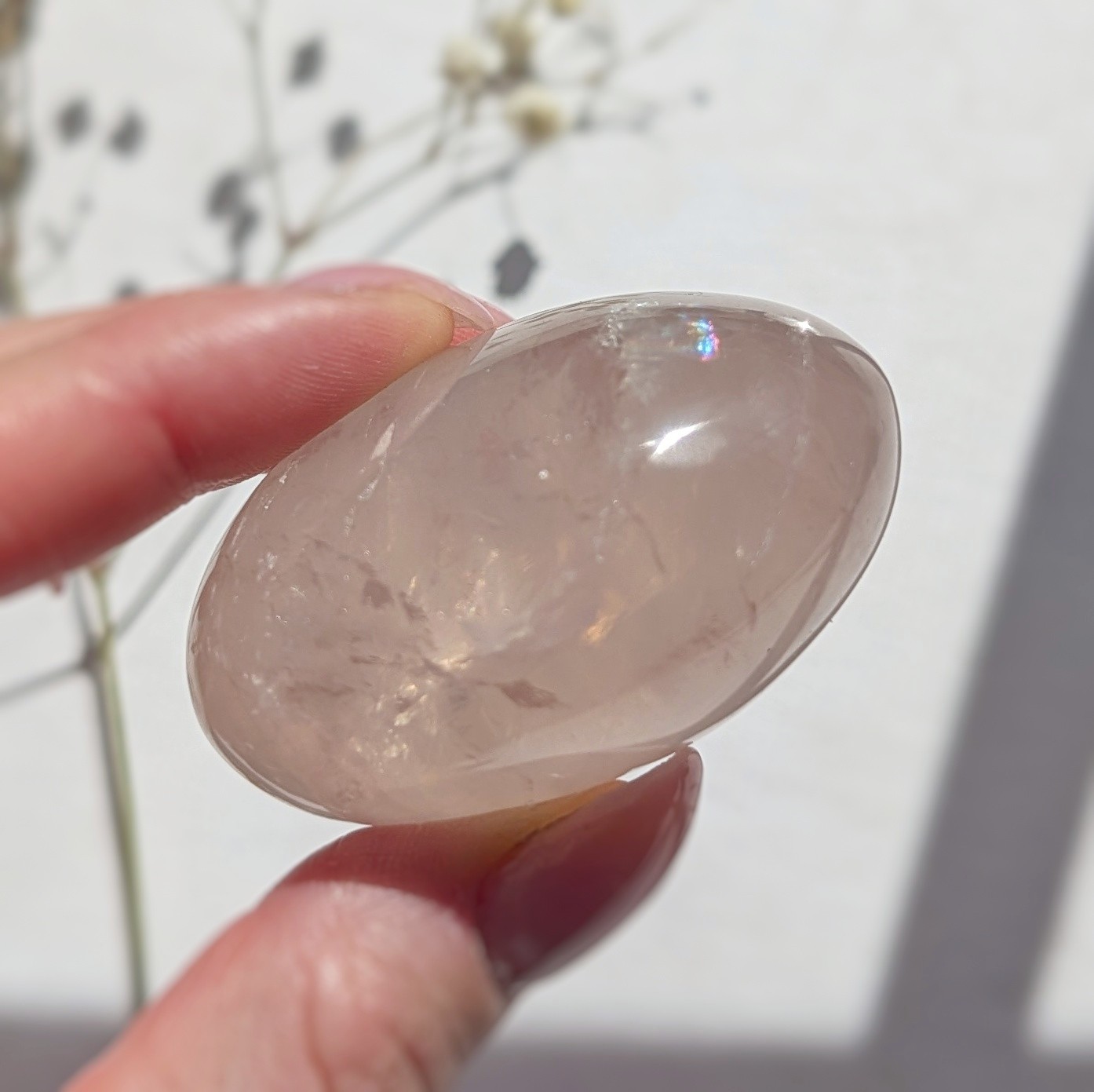 2″ translucent rose quartz palmstone with rainbow and asterism, star rose quartz
