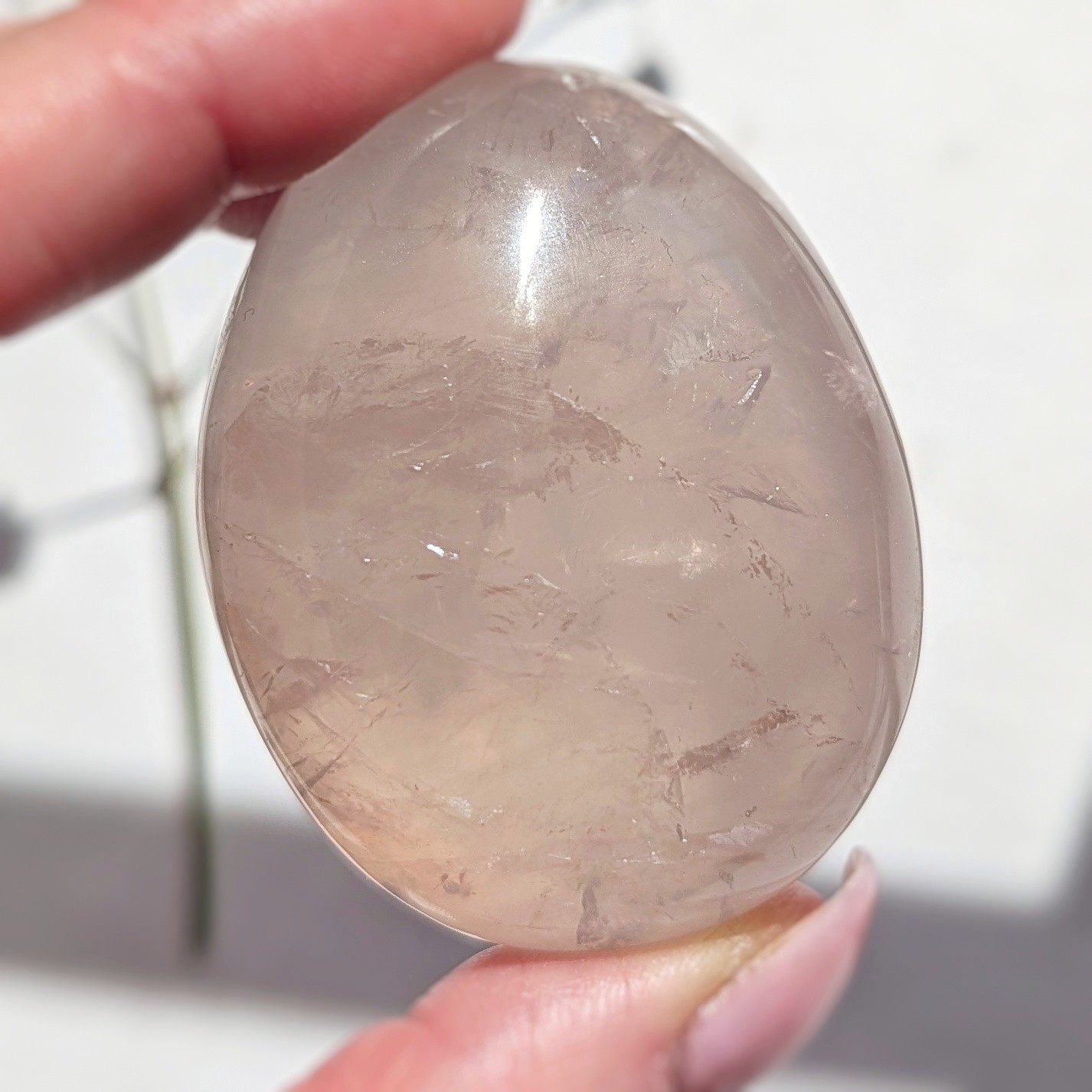 2″ translucent rose quartz palmstone with rainbow and asterism, star rose quartz