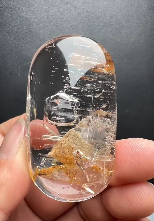 55*31*17mm Natural Enhydro Quartz Moving Water Drop Specimens Palm Reiki