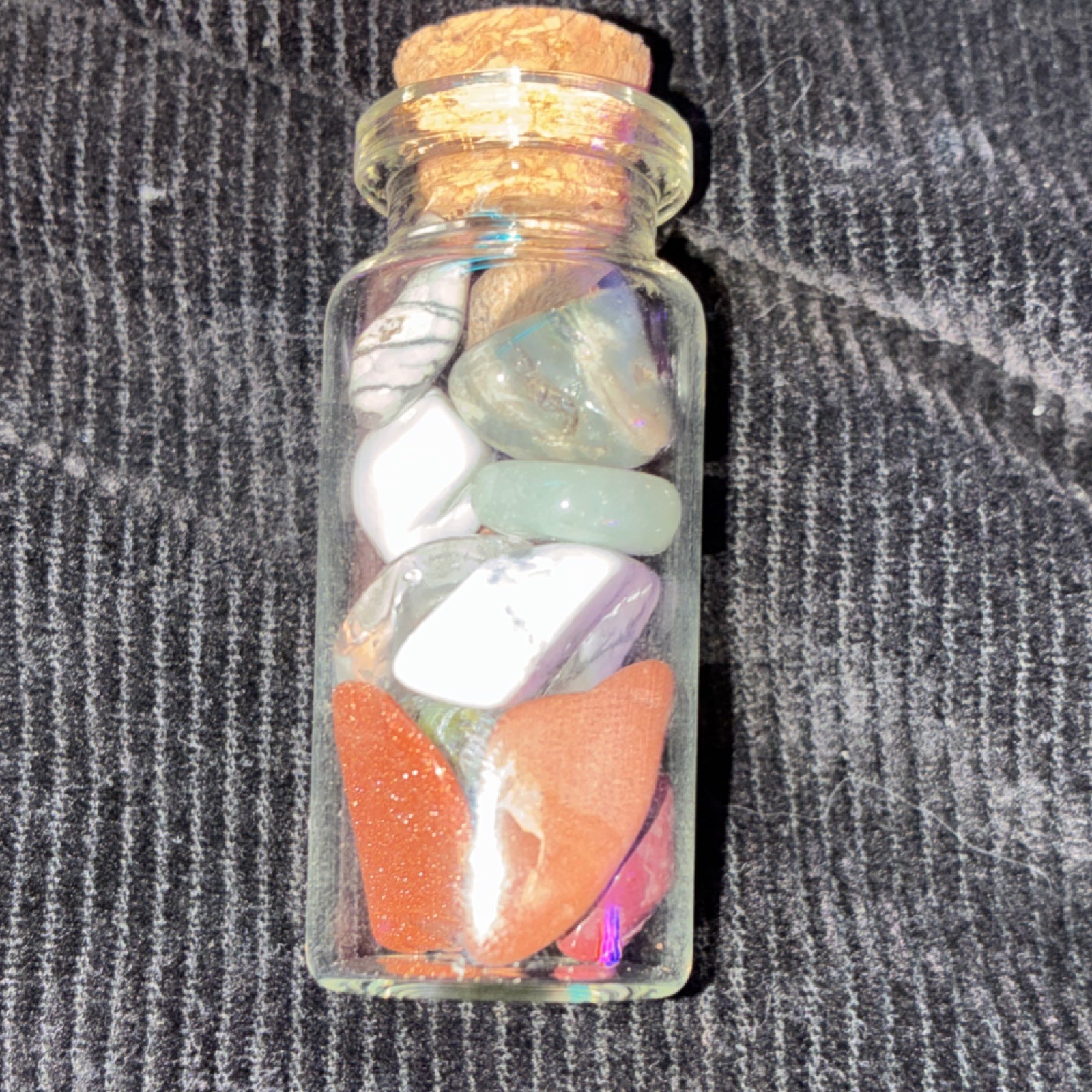 Glass Jar Filled with Assorted Tumbled Crystals and Stones