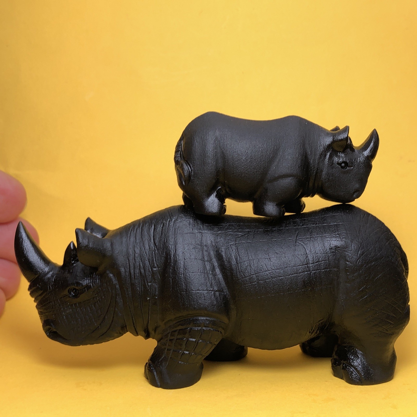 Top natural obsidian crystal quartz mineral label hand-carved rhinoceros family.