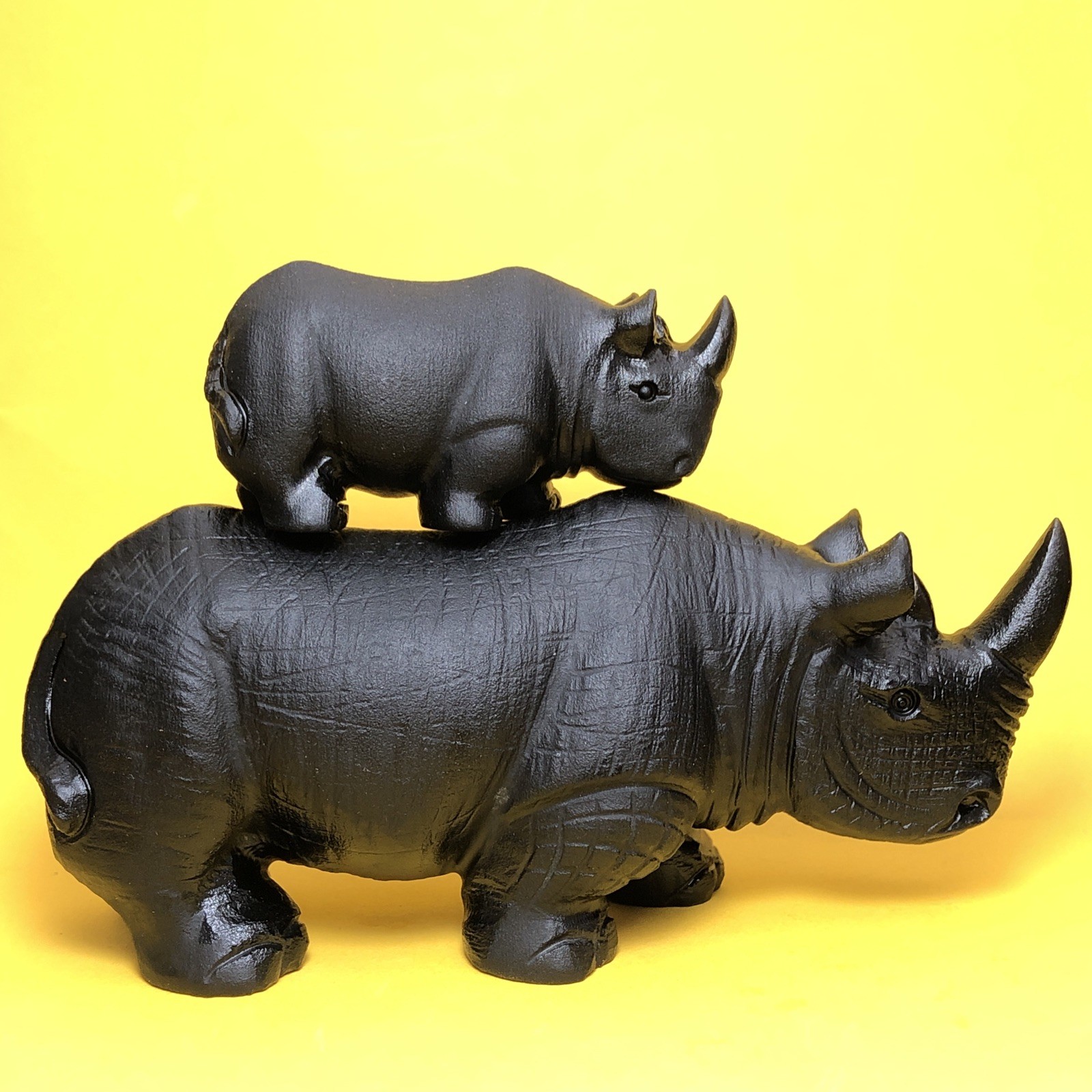 Top natural obsidian crystal quartz mineral label hand-carved rhinoceros family.