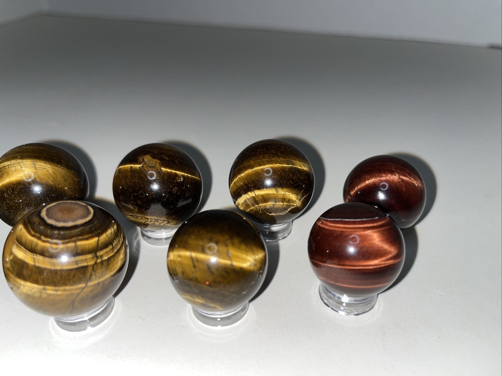 Sphere lot/tigers eye with acrylic stands.