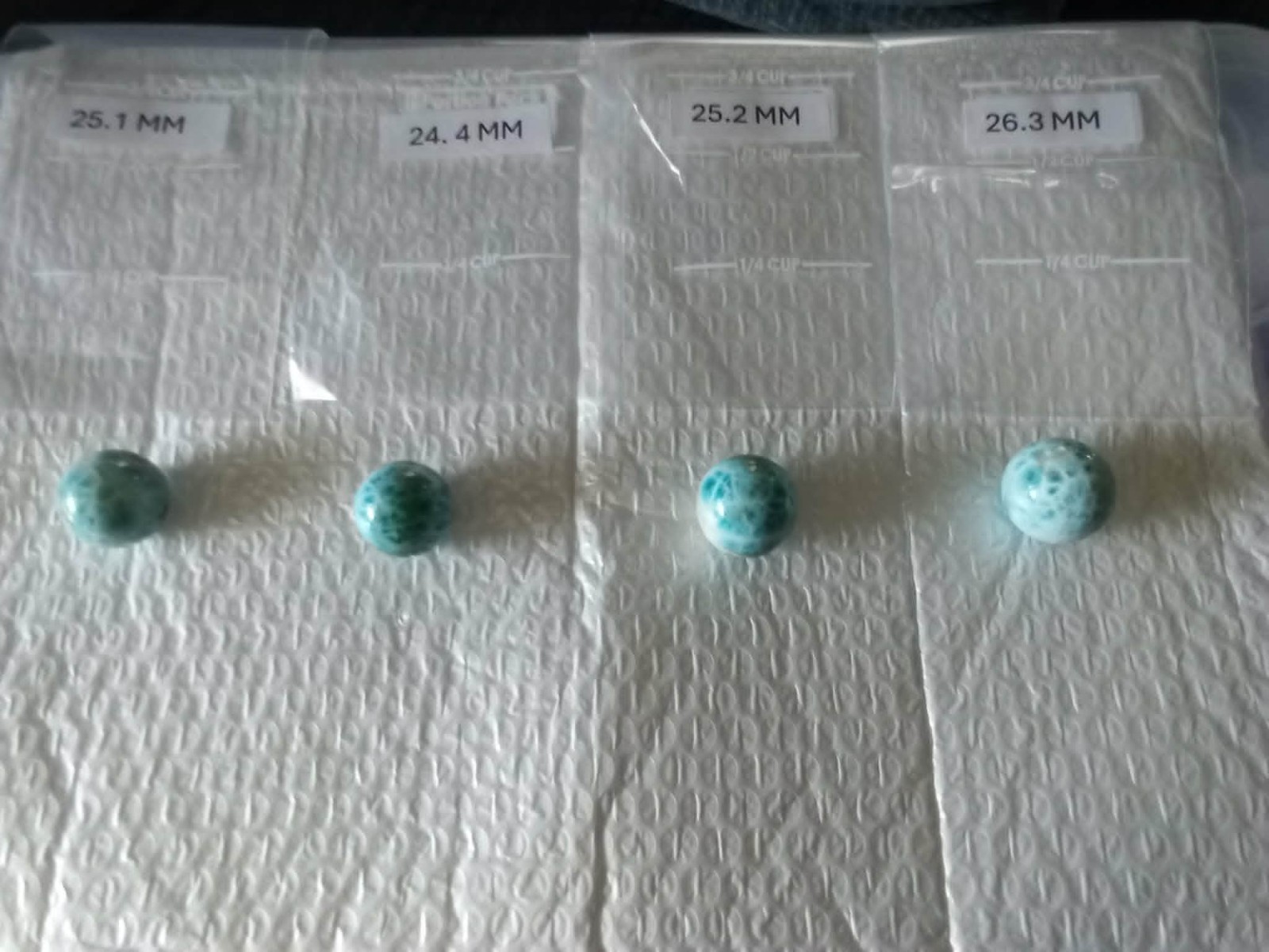 DOMINICAN REPUBLIC LARIMAR SPHERES LOT OF FOUR 24 MM TO 26 MM