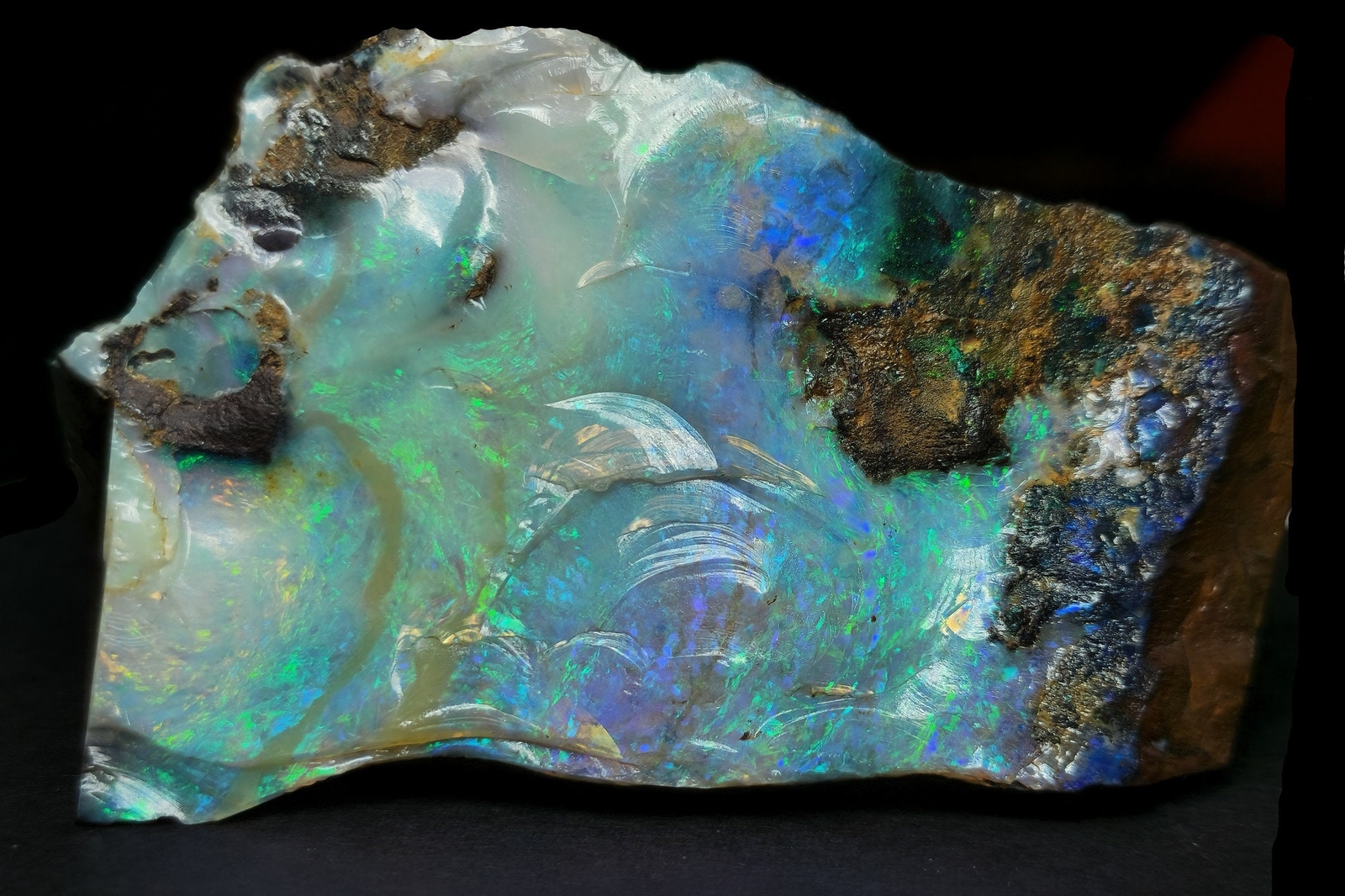 54081.0 – Australian Rough Boulder Opal specimen with the whole side covered