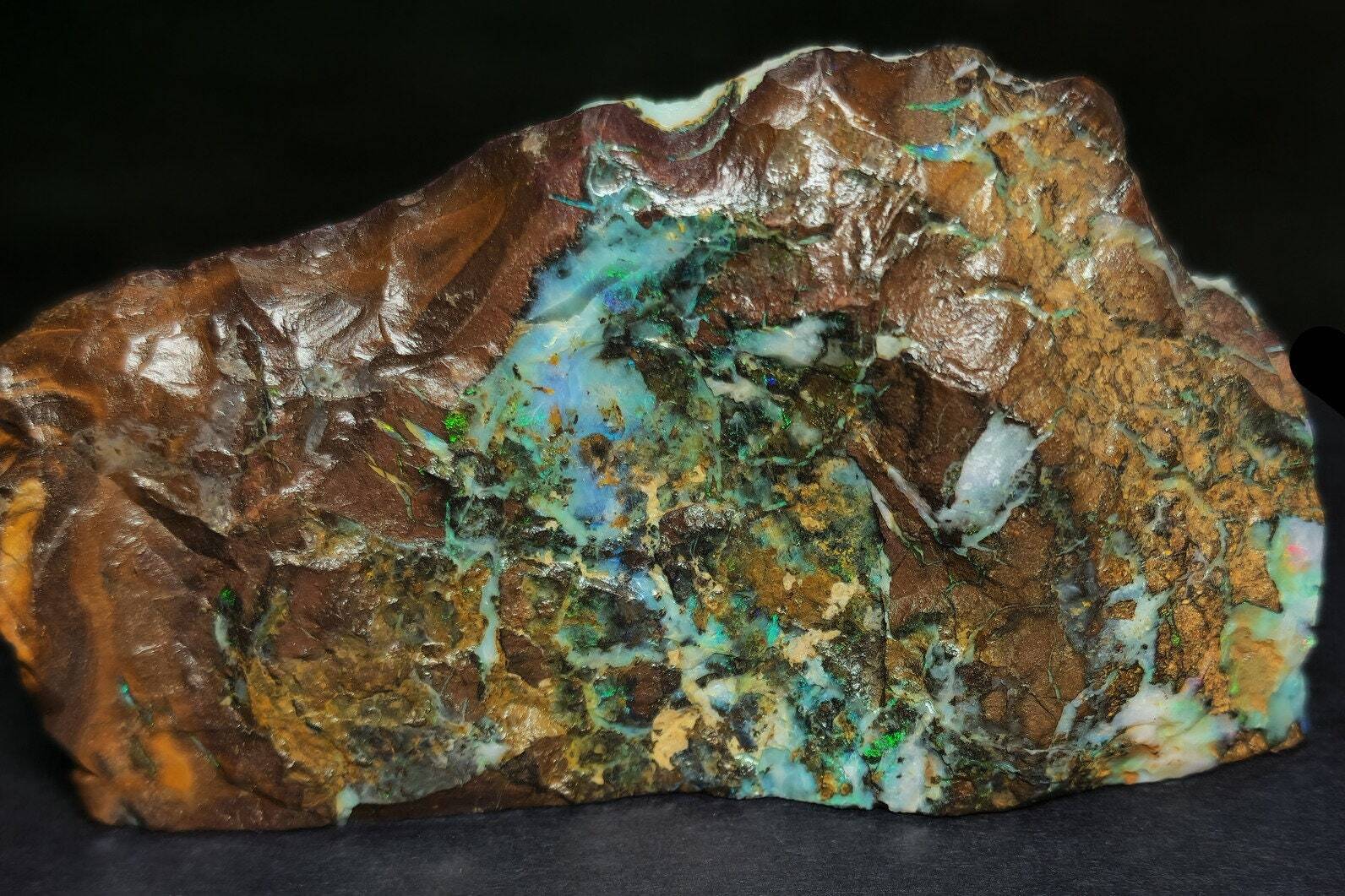 54081.0 – Australian Rough Boulder Opal specimen with the whole side covered