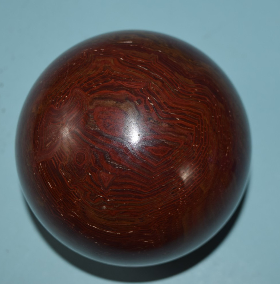 4″ Red-Brown Onyx Sphere – Hand-Carved in Pakistan Paperweight flat bottom