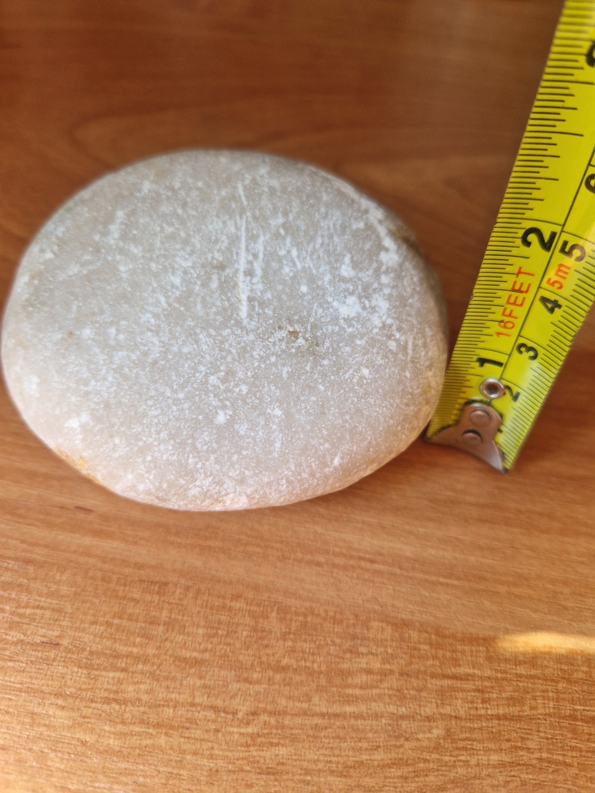 Natural round polished white stone.