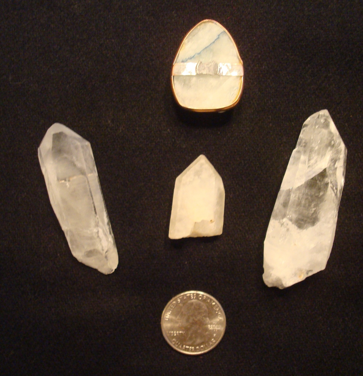 Quartz crystals, includes a white geode crystal slice in a metal setting