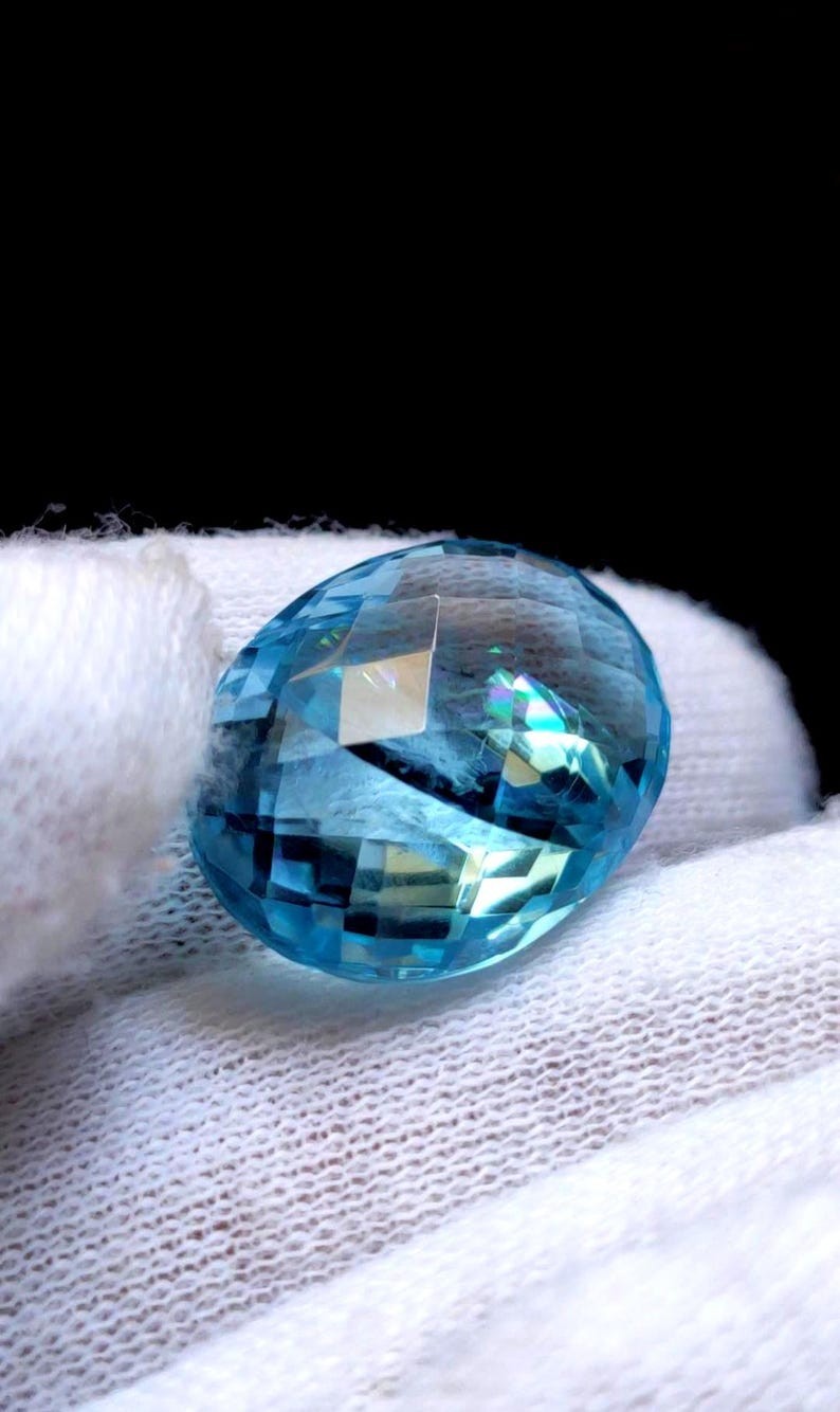 Rare 2 Pieces in 1 Blue Topaz With Rare Rainbow schiller effect : 24 Carats
