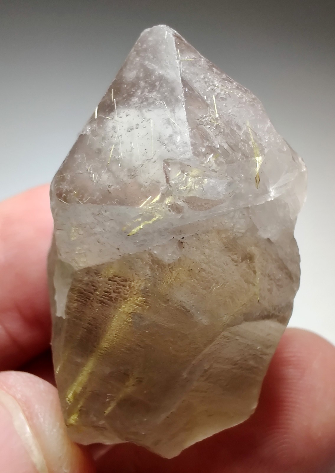 Terminated Quartz crystal with golden Rutile inclusions. Brazil. 35 grams.