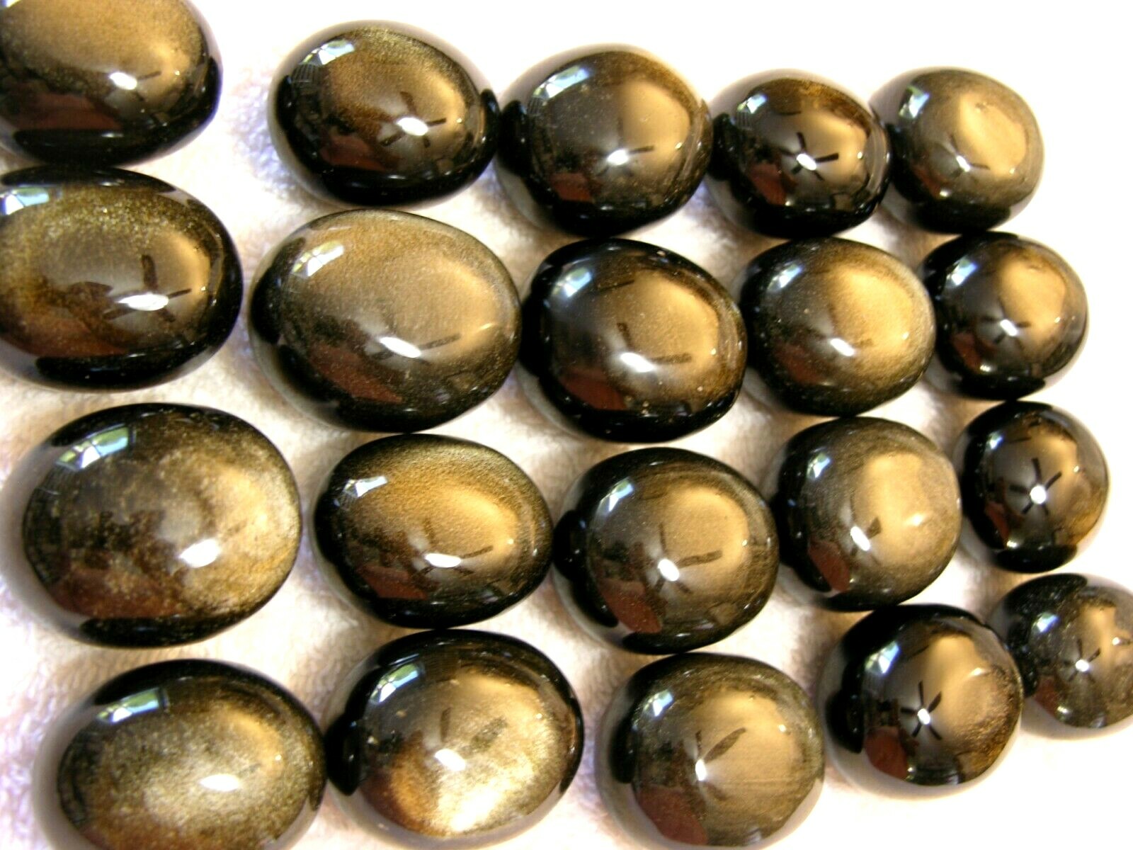 Golden silver sheen obsidian palm stone gem grade 1.5×1 inch 1 stone per winner