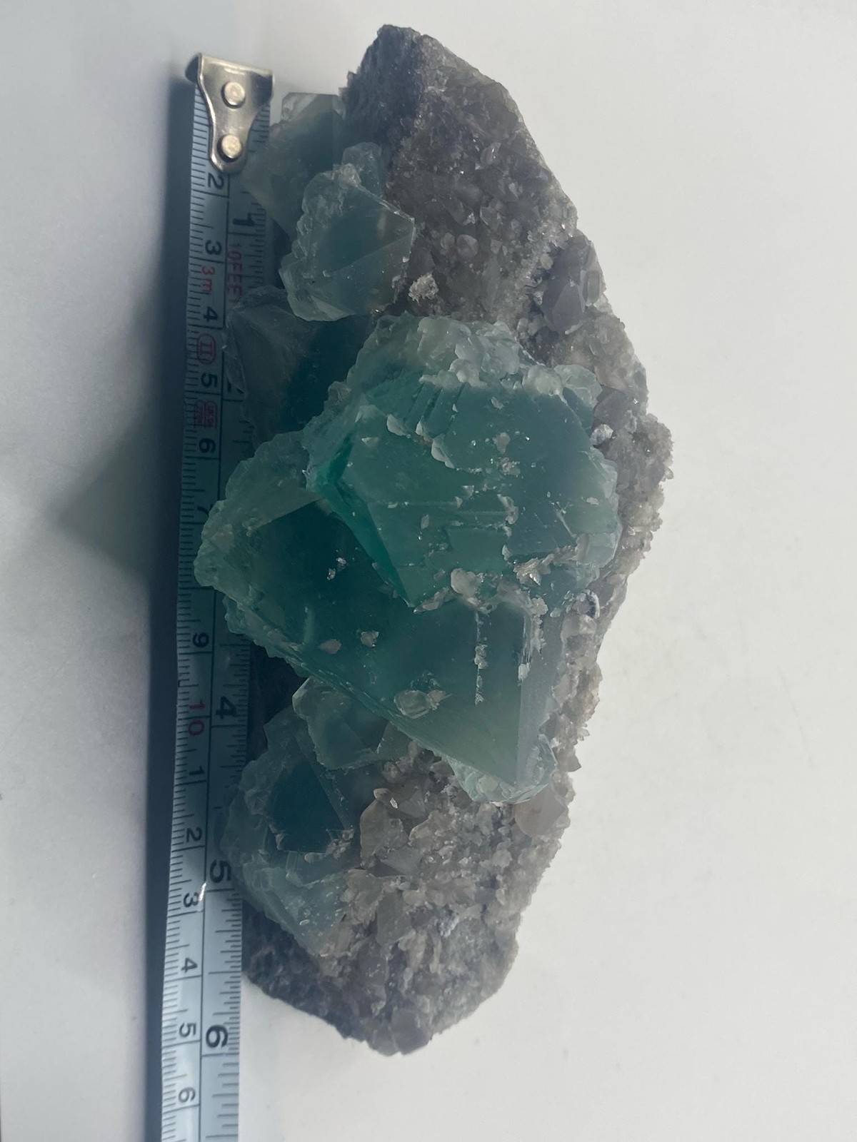 Teal Fluorite Octahedron Cluster on Smoky Quartz