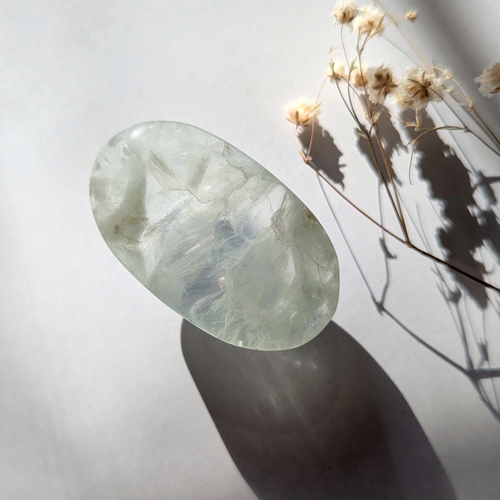 2″ ethereal mint green translucent fluorite palmstone, fluorescent fluorite