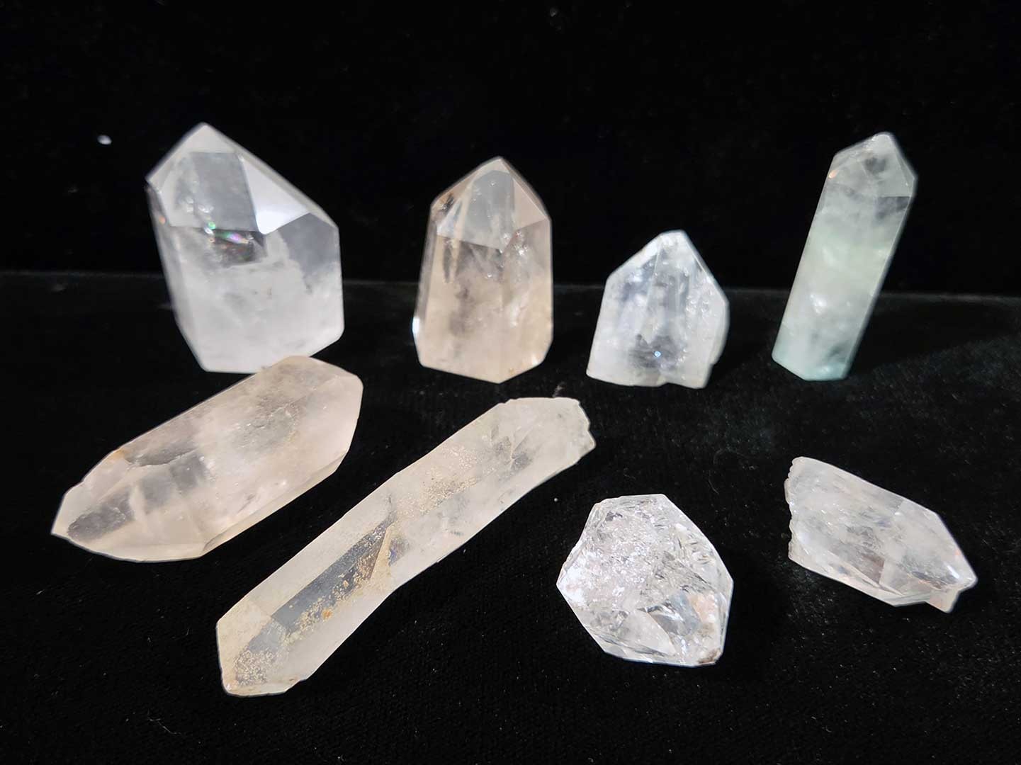 Collection of 9 clear quartz crystal points, 1in. to 3in.