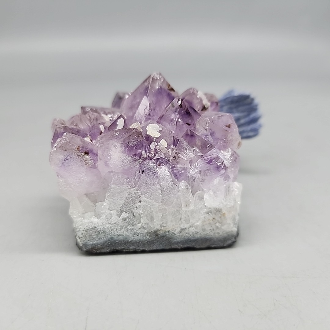Vintage gemstone Blue Ceramic Macaw perched on Purple amethyst base 4″