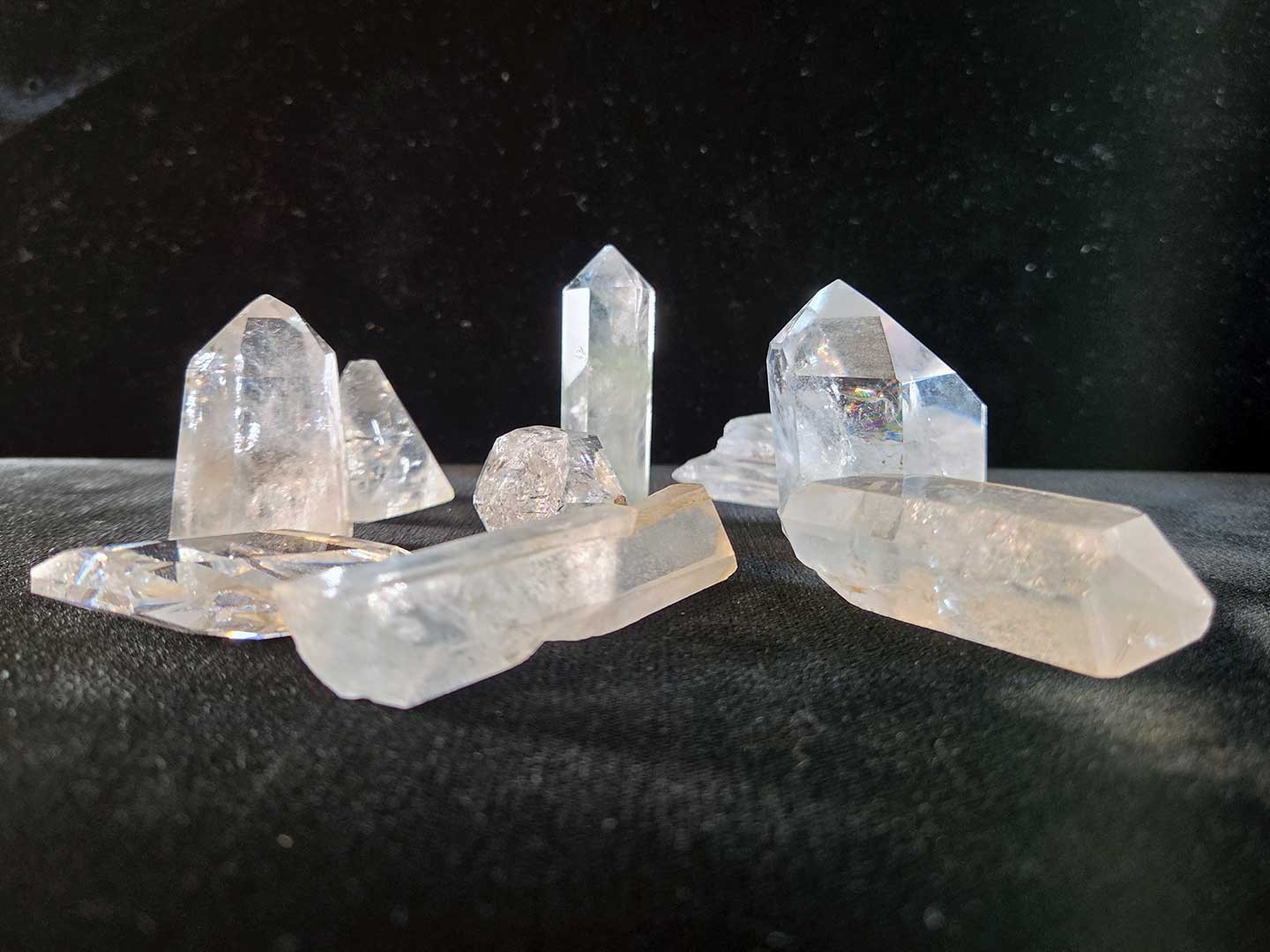 Collection of 9 clear quartz crystal points, 1in. to 3in.