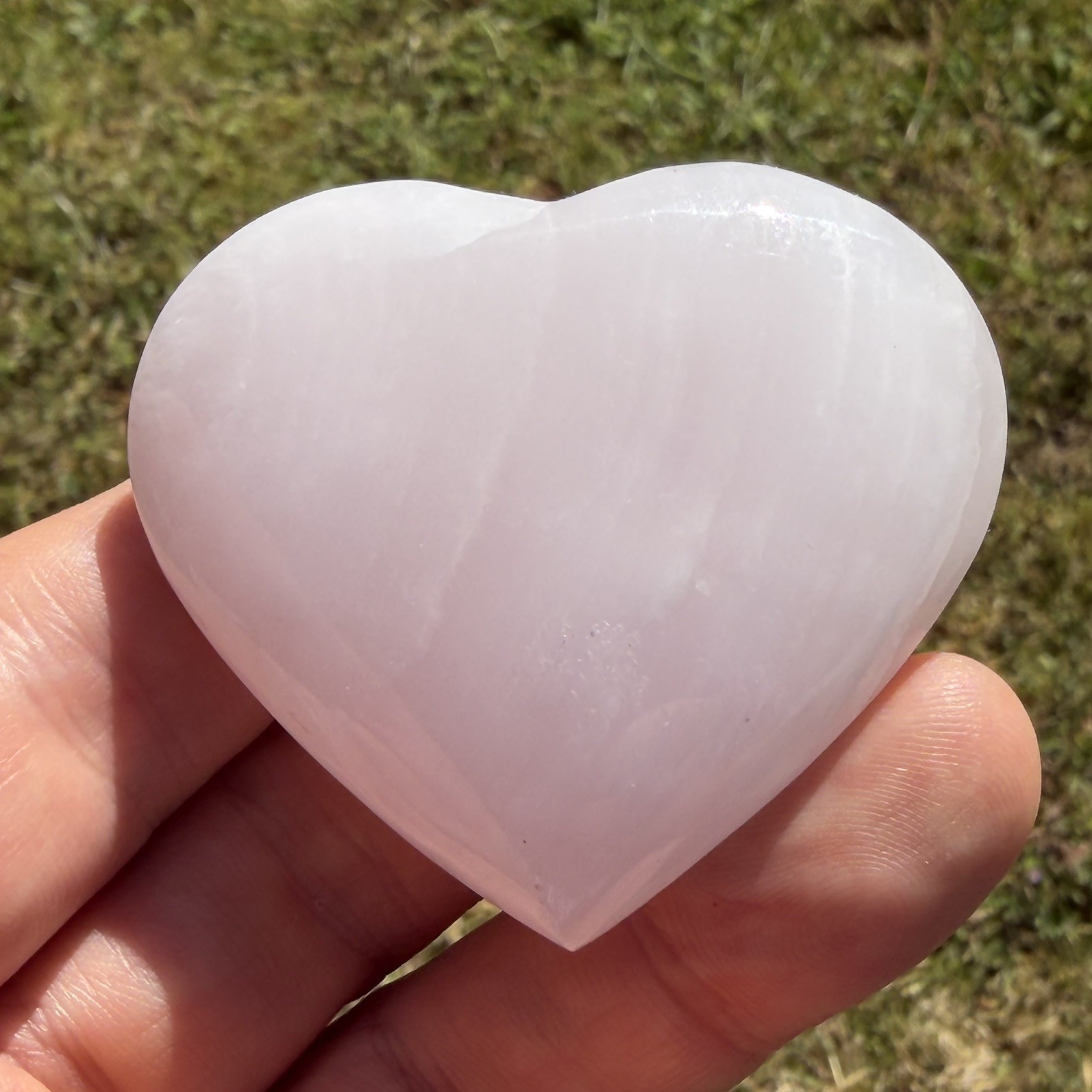Polished Mangano Calcite Heart 71 grams approx 5.5cm X 5cm Approx UV sensitive