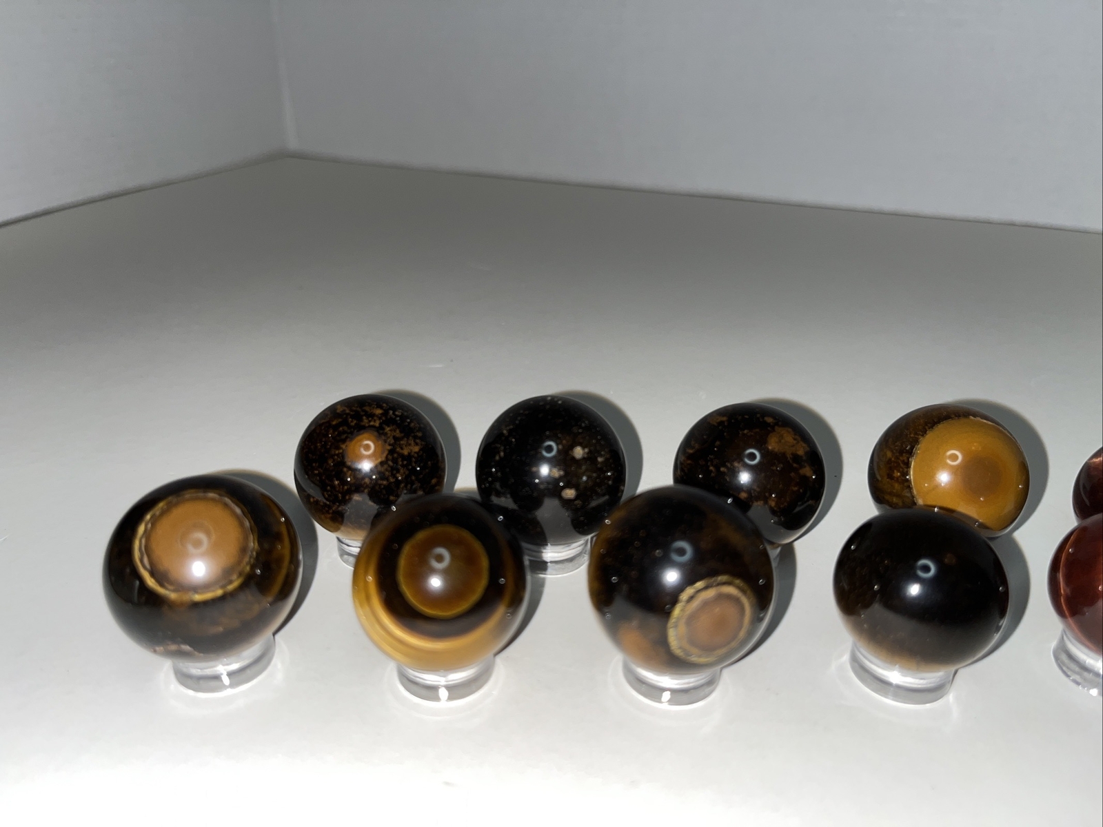 Sphere lot/tigers eye with acrylic stands.