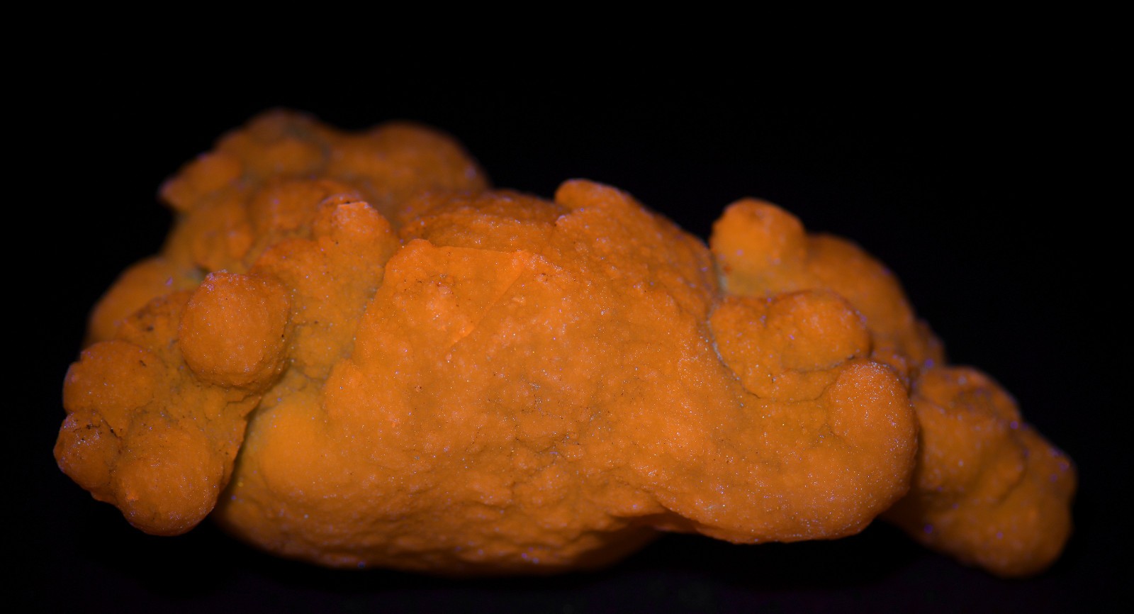 Chalcedony nodule, fluorescent orange. Morocco. 60 grams.