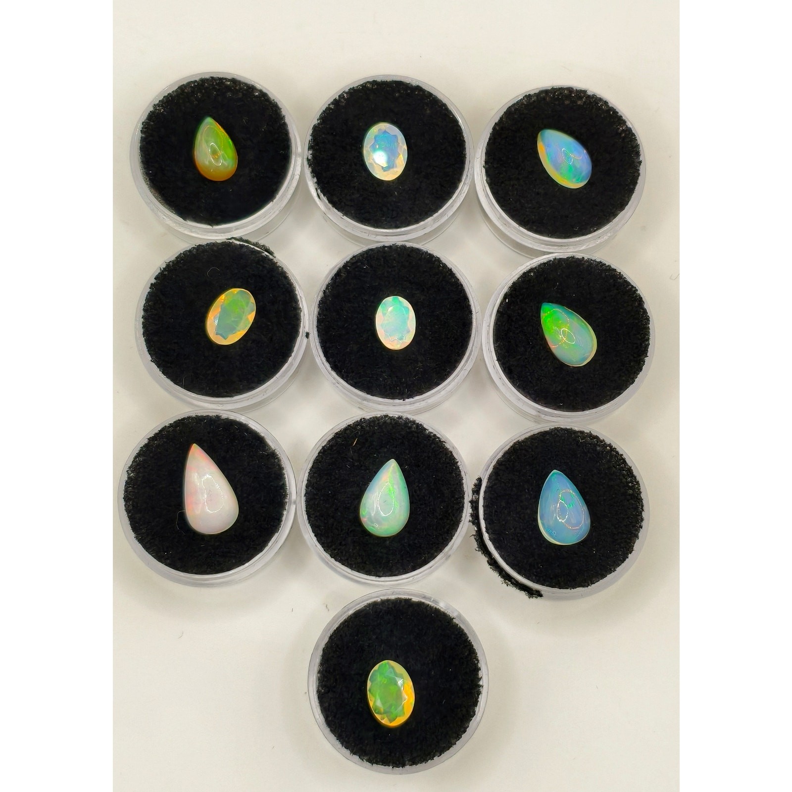 10-Piece 18.60ctw Ethiopian Welo Opal Cabochon & Faceted Gem Lot with Caps