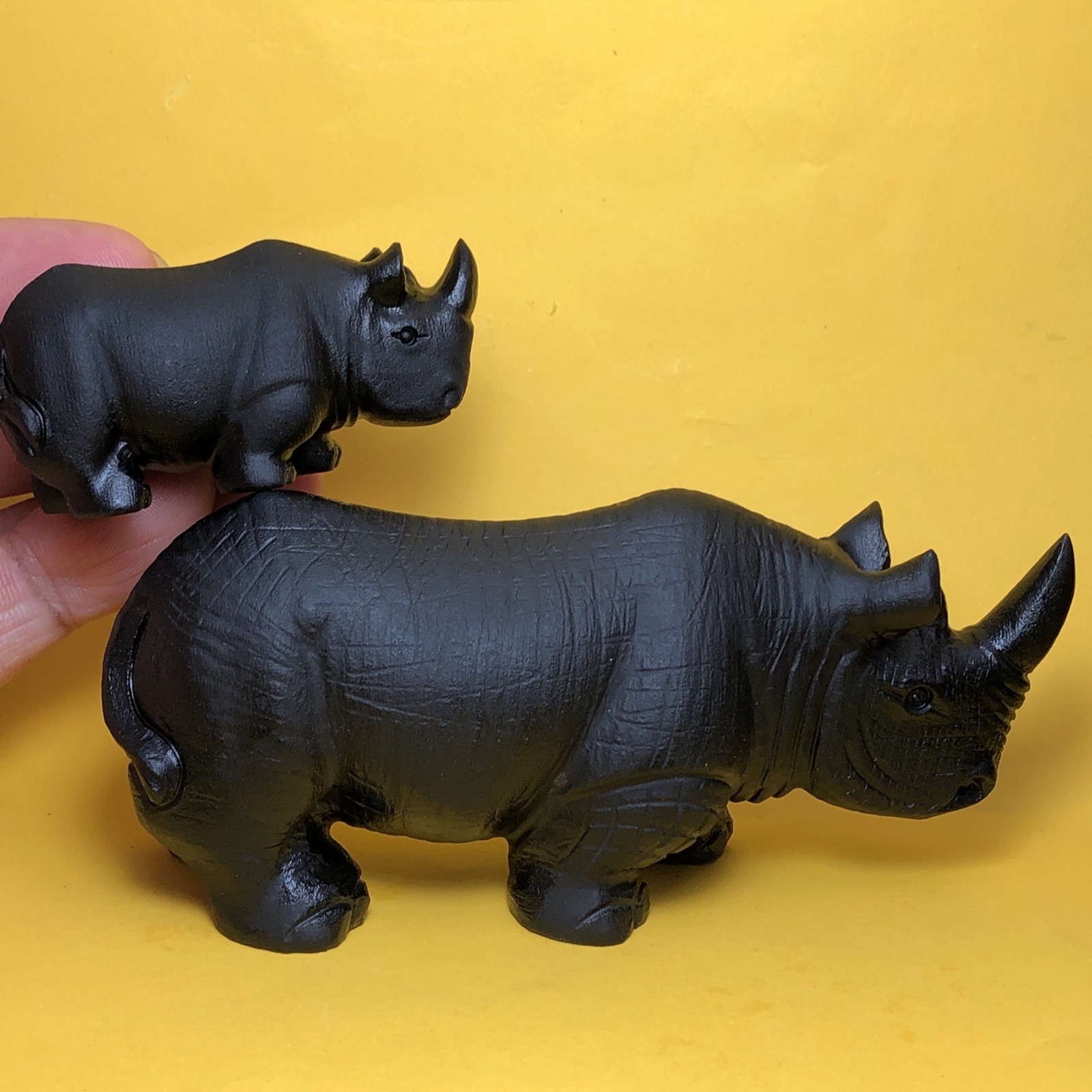 Top natural obsidian crystal quartz mineral label hand-carved rhinoceros family.