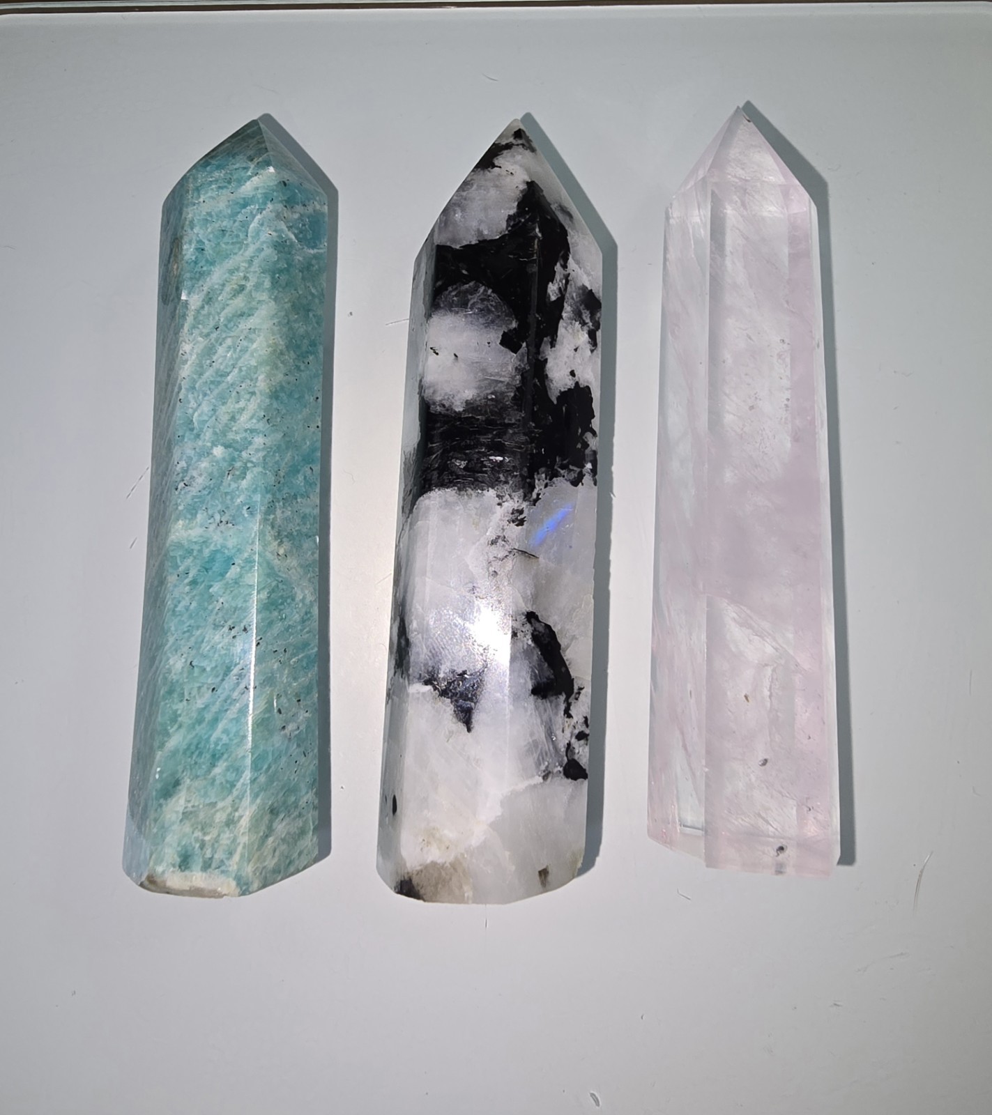 Three 4 inch Towers. Light Rose Quartz, Rainbow Moonstone, and Amazonite.