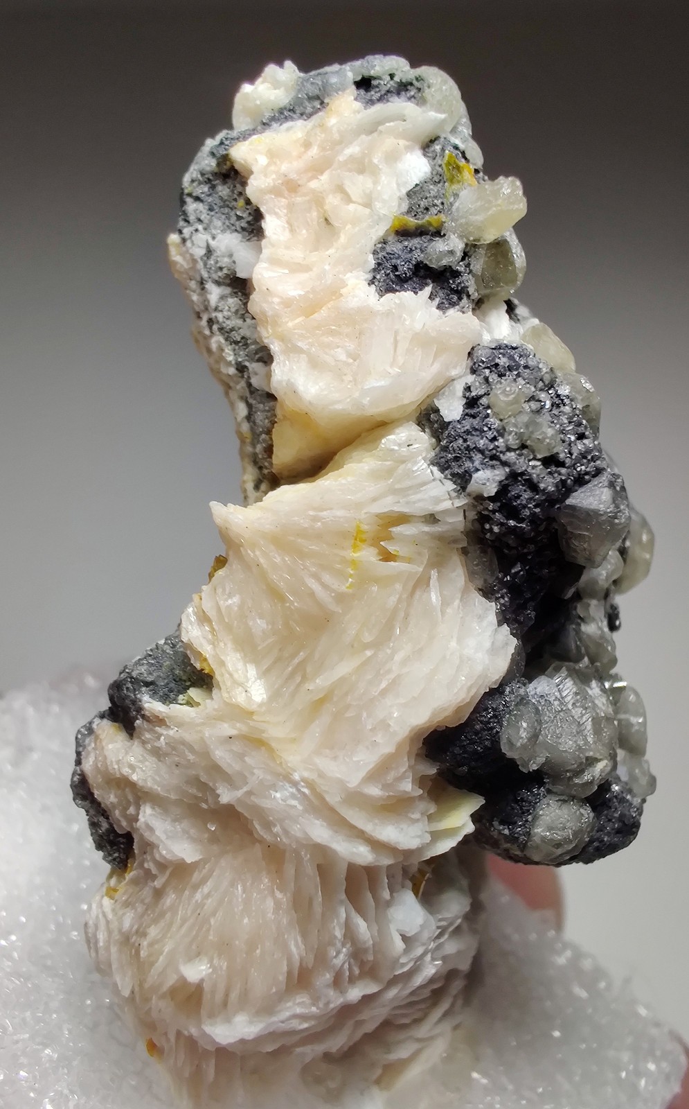 Wulfenite, Cerussite and Barite crystals, UV. Mibladen, Morocco. 6 cm.