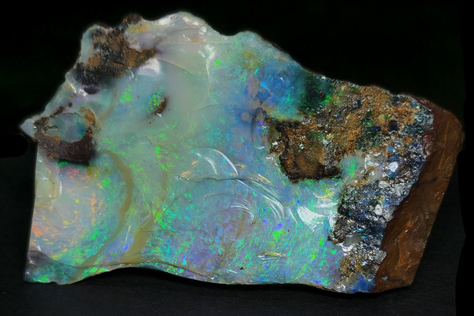 54081.0 – Australian Rough Boulder Opal specimen with the whole side covered