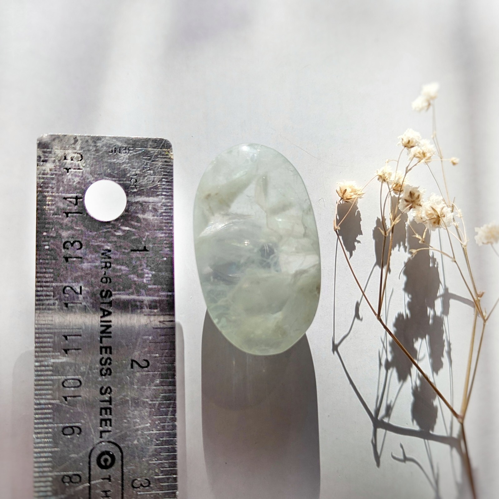 2″ ethereal mint green translucent fluorite palmstone, fluorescent fluorite