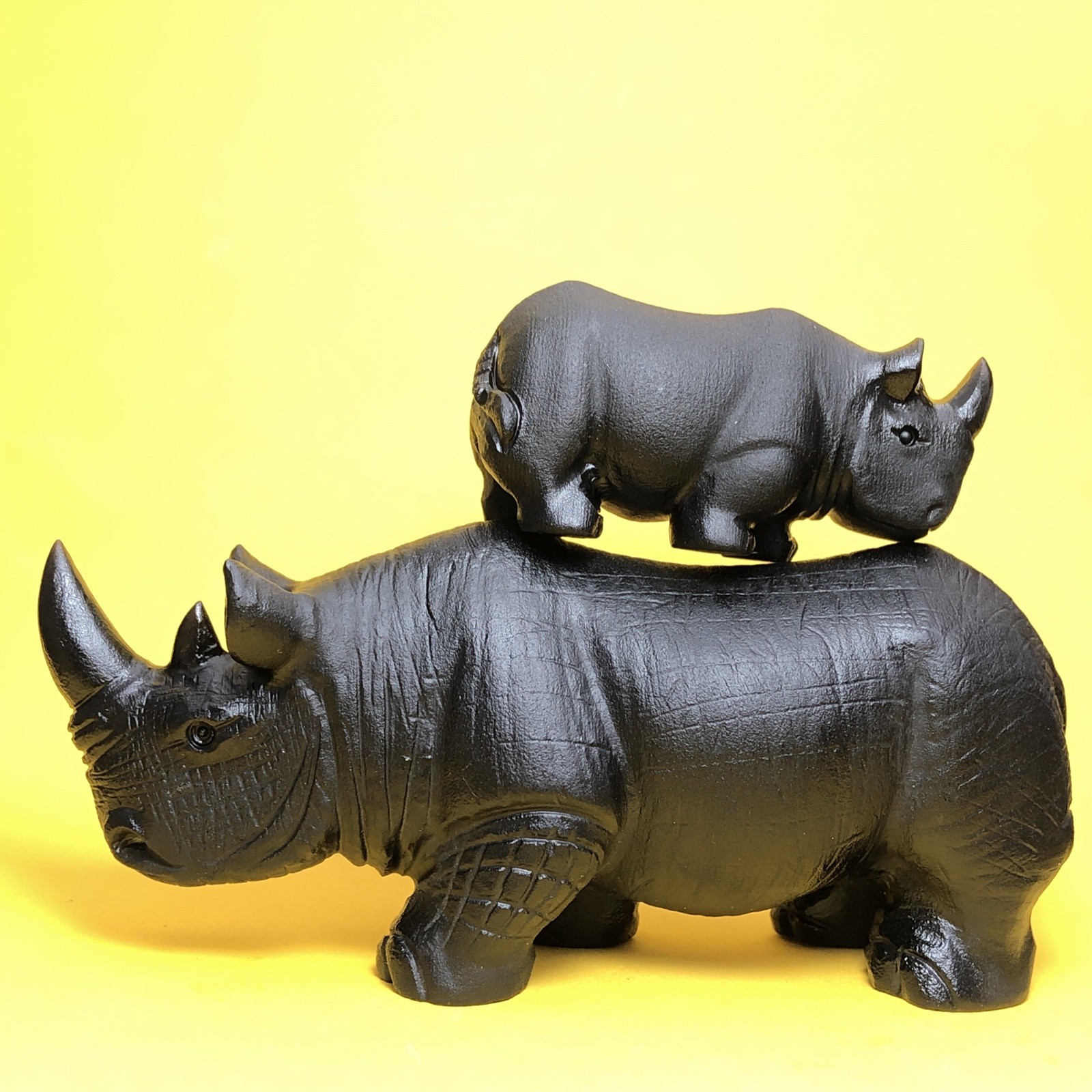 Top natural obsidian crystal quartz mineral label hand-carved rhinoceros family.