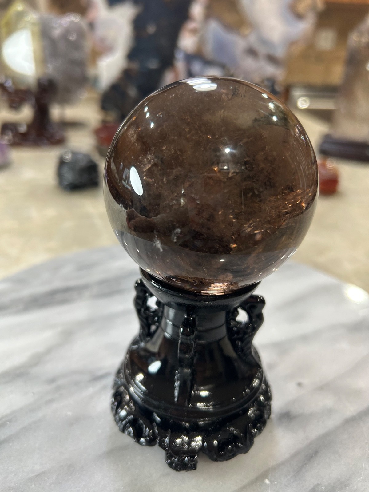 Smoky quartz sphere on resin stand 2.72”