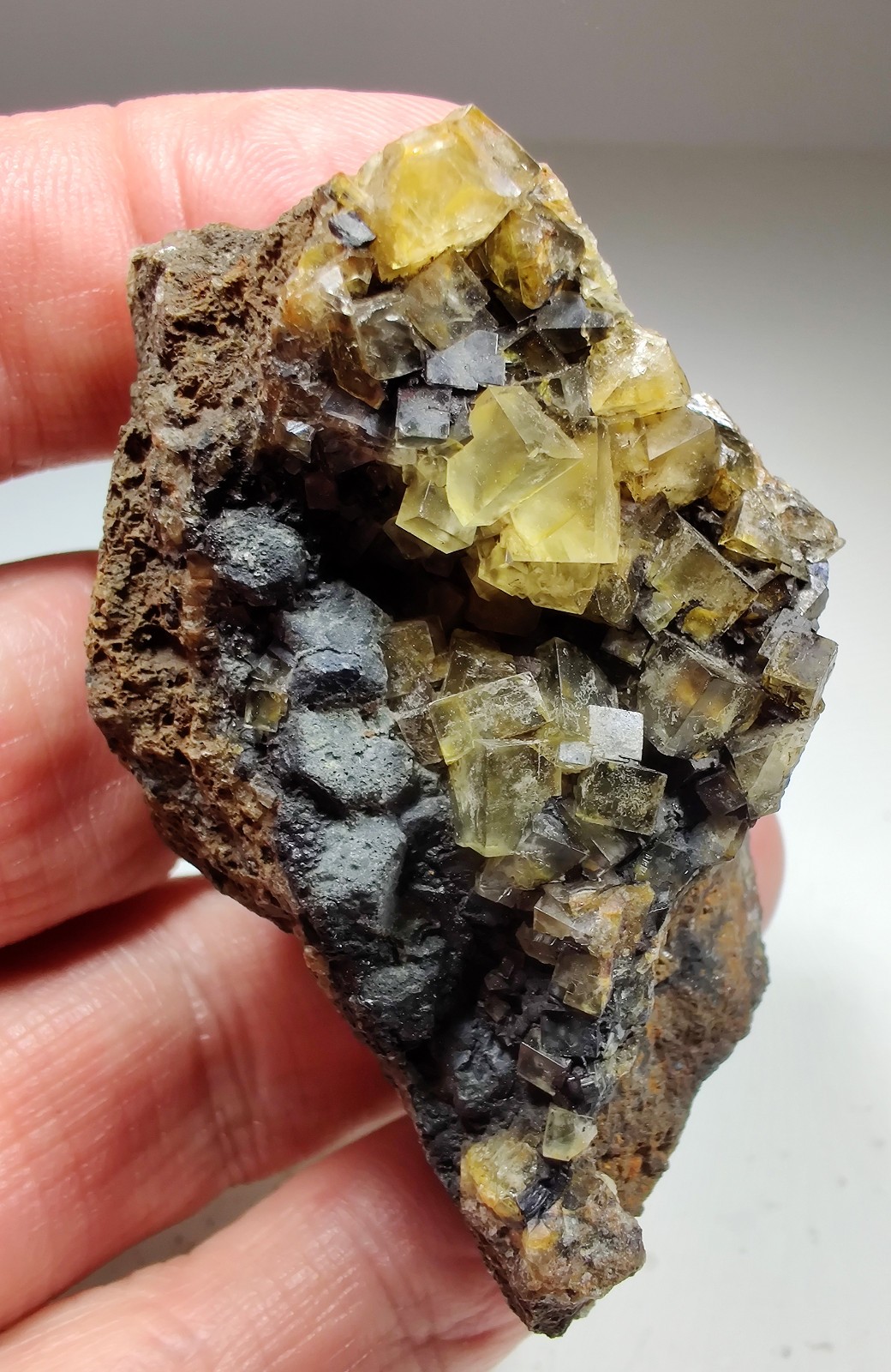 Fluorite crystals with Tar smell!. Illinois-Kentucky Fluorspar Dist. 118 grams.