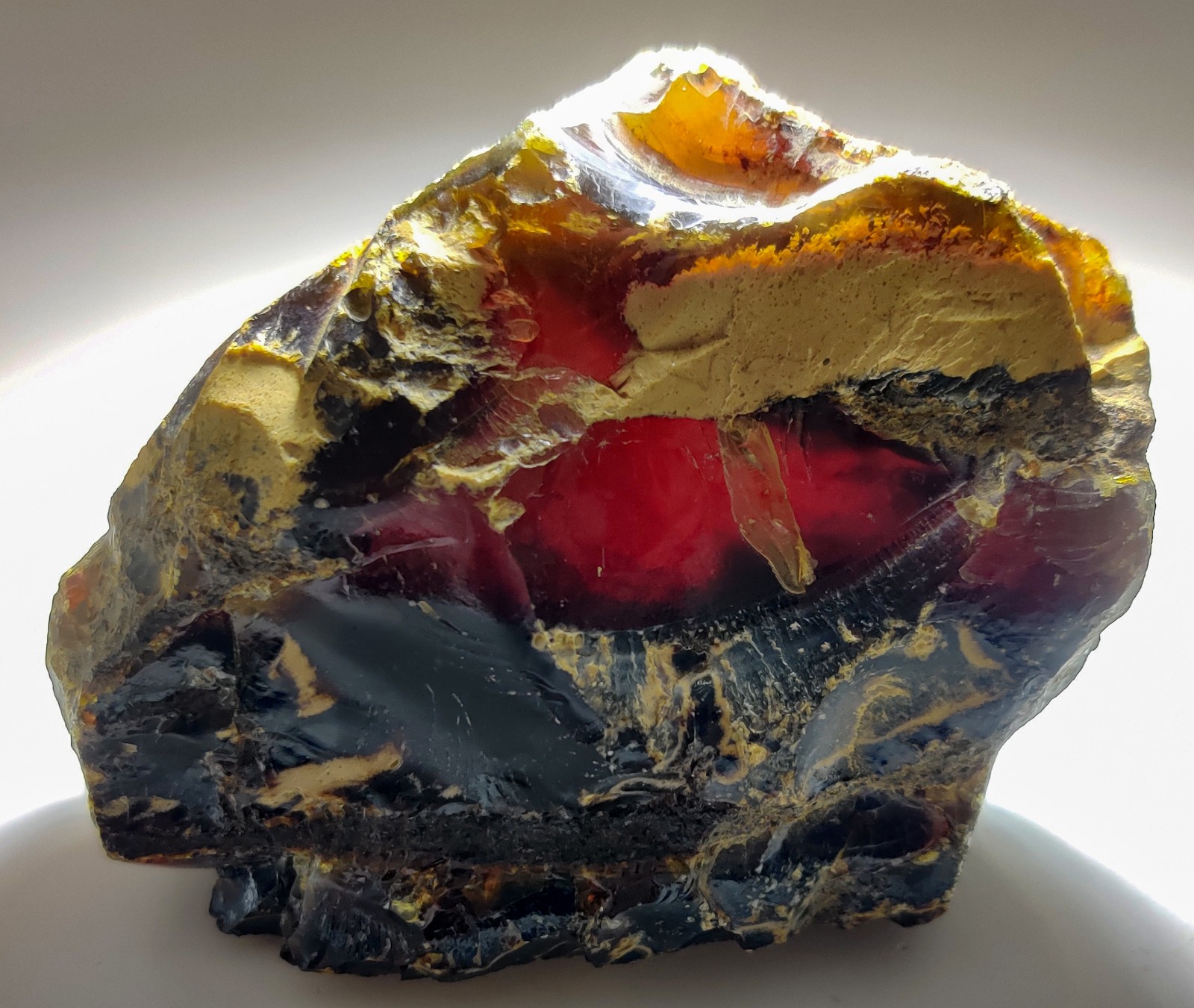 Amber, fluoresces blue. From Sumatra, Indonesia. 188 grams.