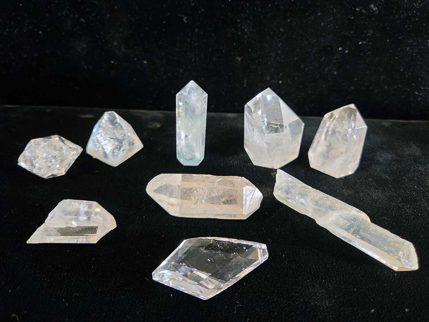 Collection of 9 clear quartz crystal points, 1in. to 3in.