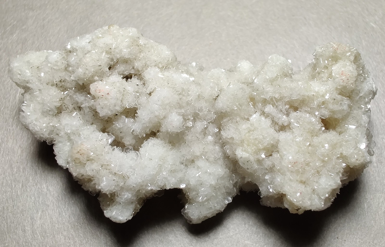 Barite crystals, tiny spherical clusters, UV. Minerva Mine, Illinois. 25 grams.
