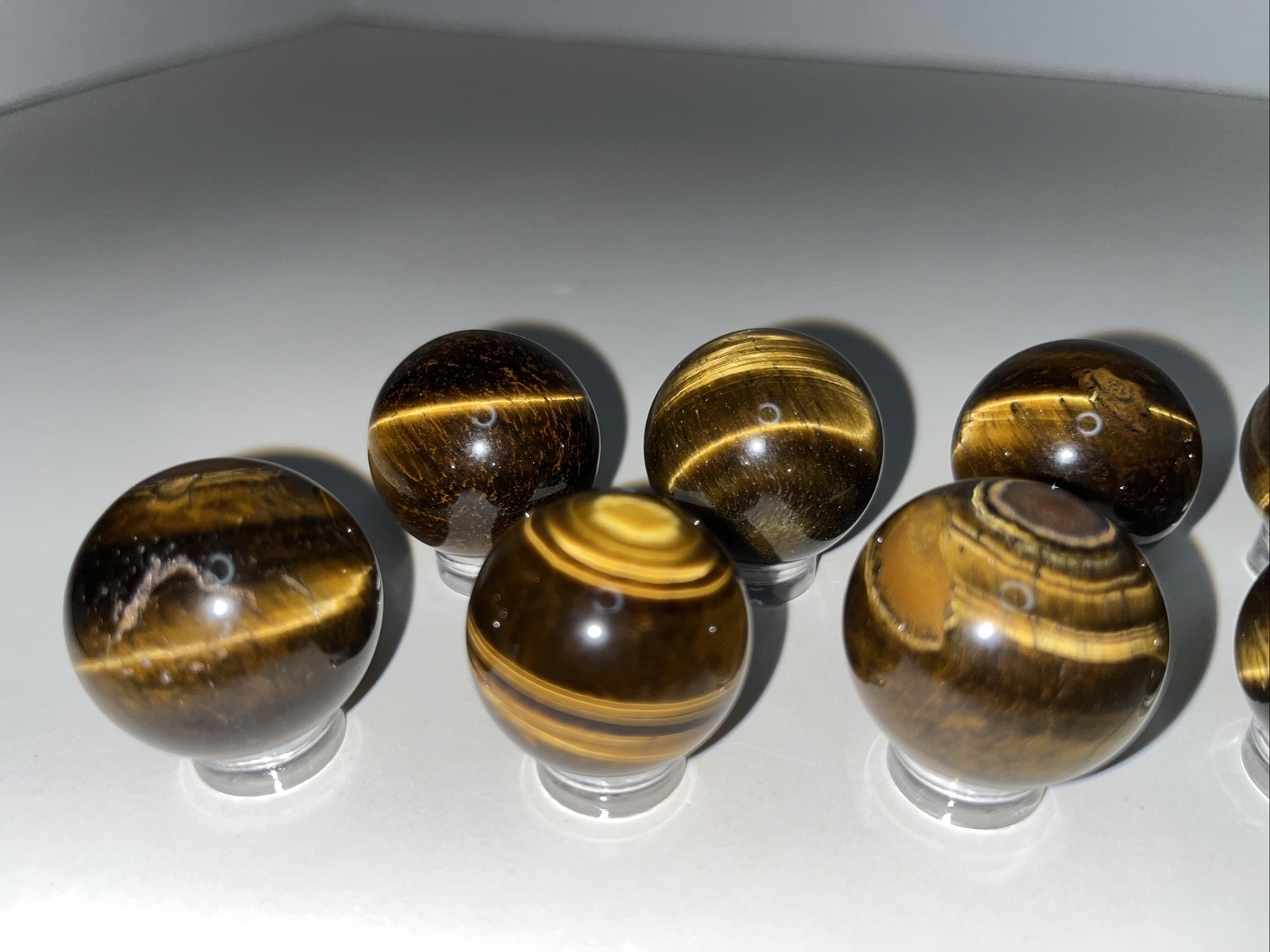 Sphere lot/tigers eye with acrylic stands.