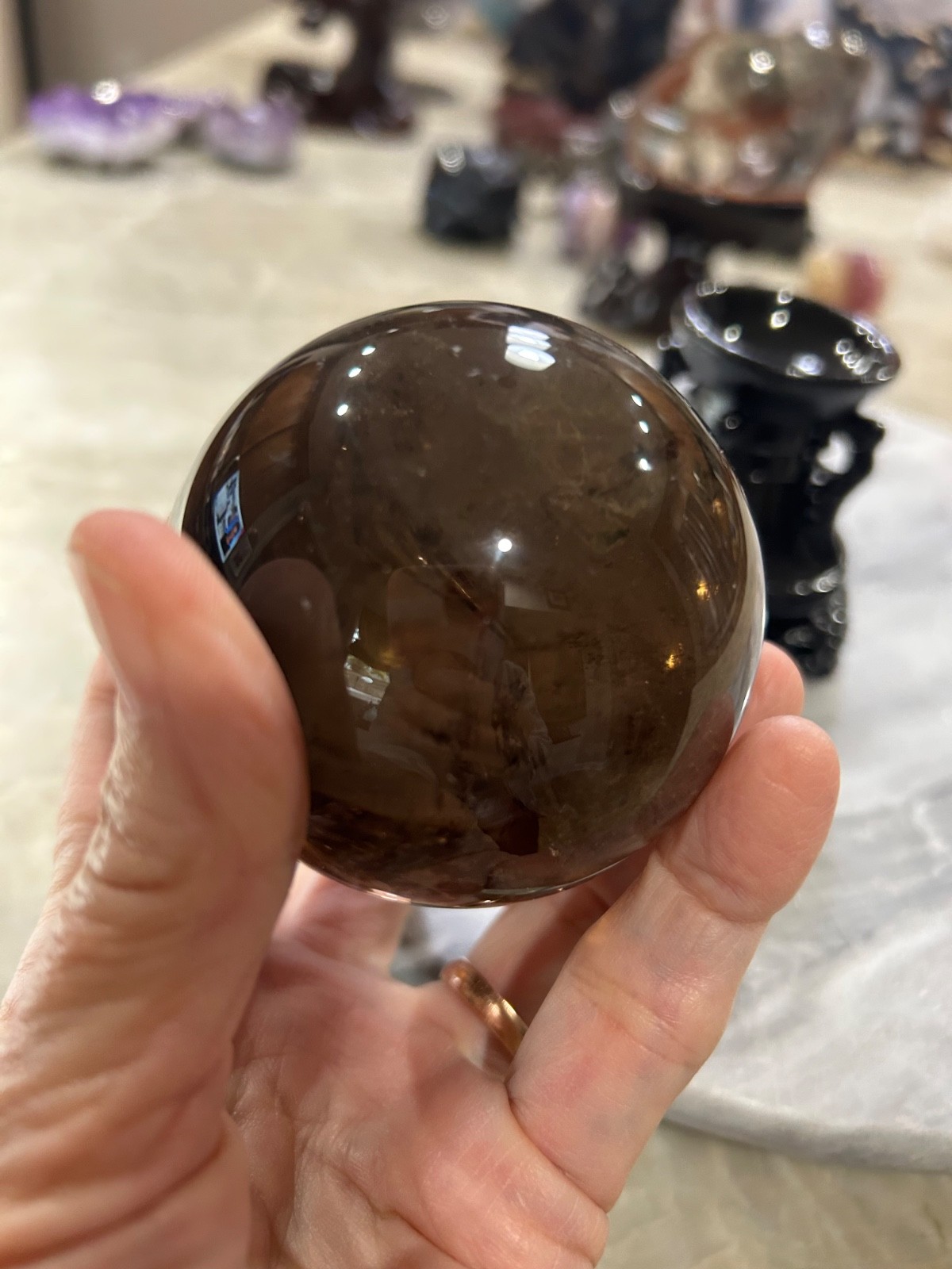 Smoky quartz sphere on resin stand 2.72”