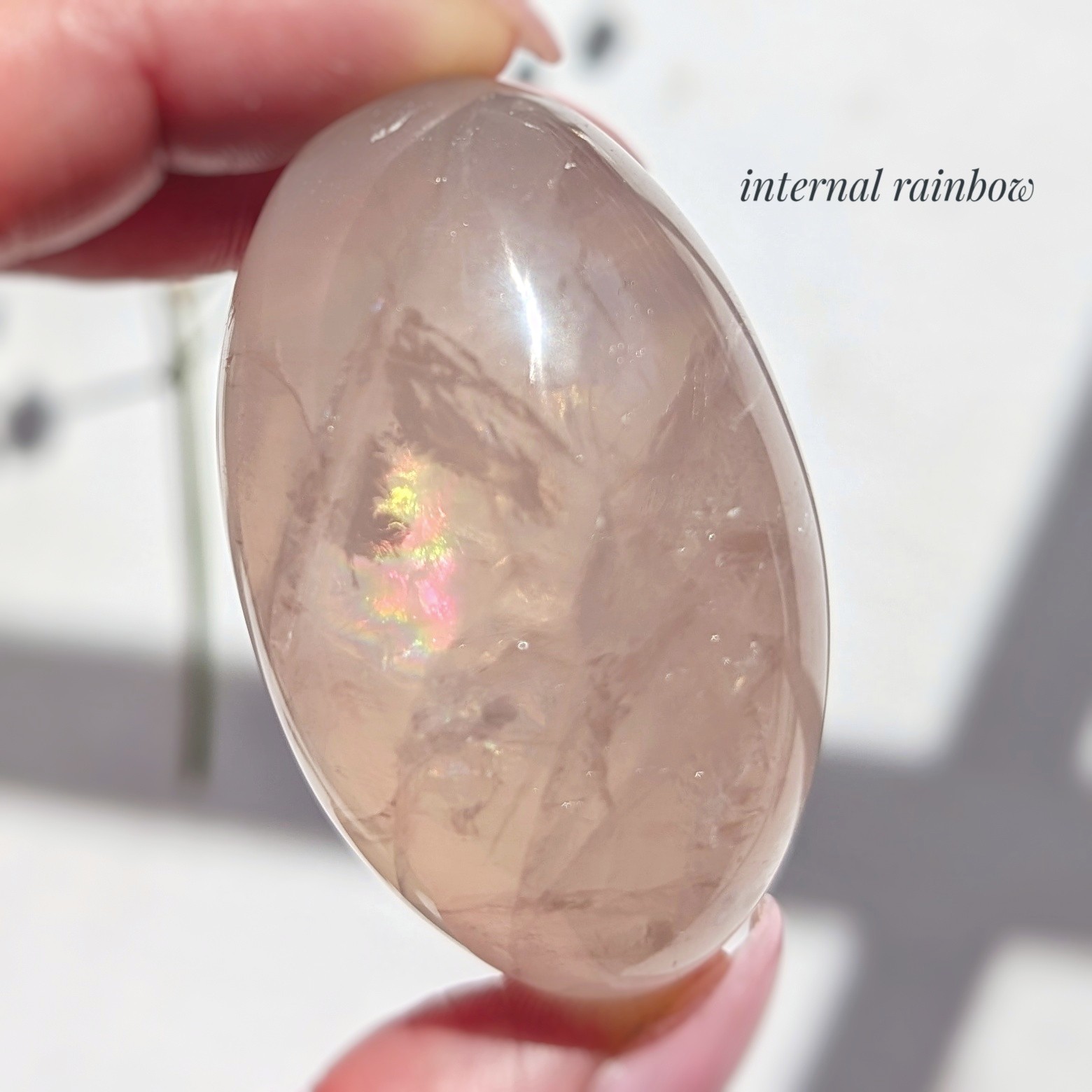 2″ translucent rose quartz palmstone with rainbow and asterism, star rose quartz