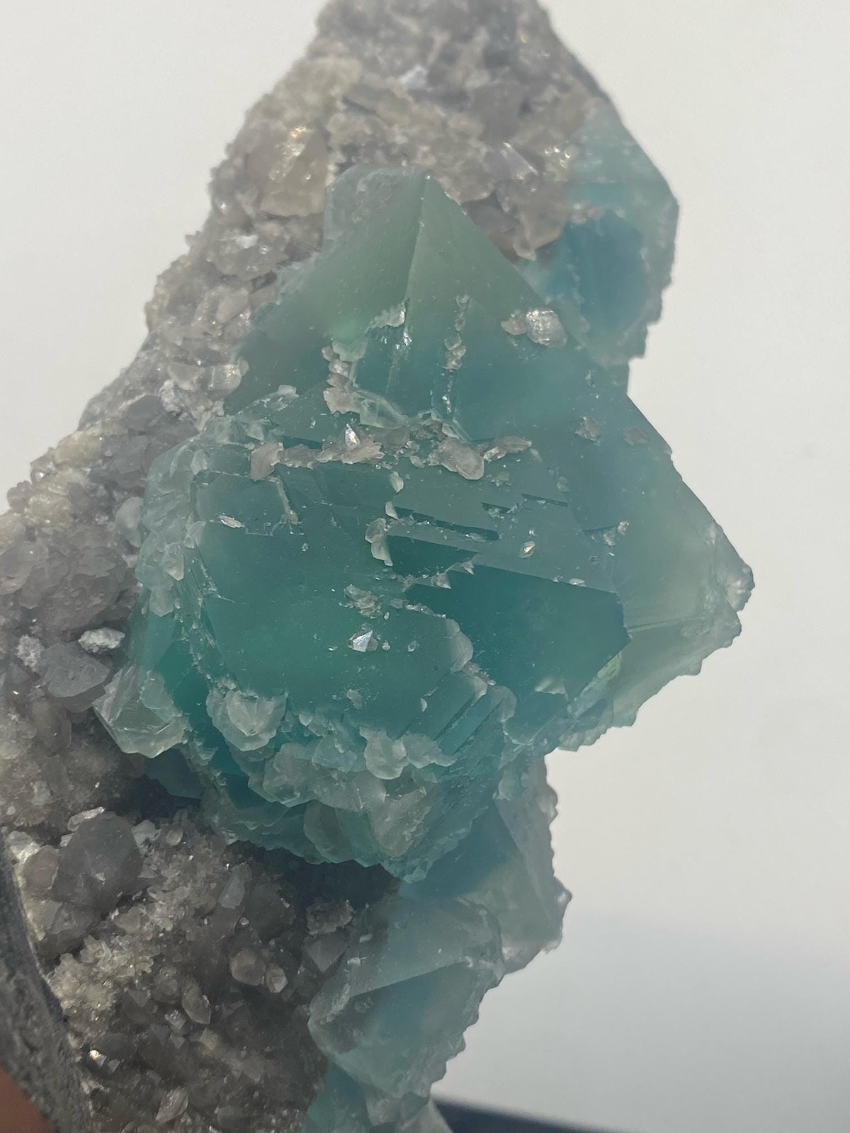 Teal Fluorite Octahedron Cluster on Smoky Quartz