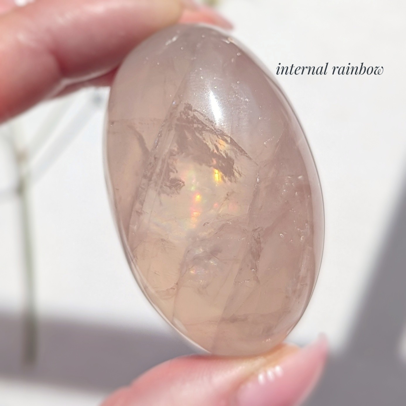 2″ translucent rose quartz palmstone with rainbow and asterism, star rose quartz