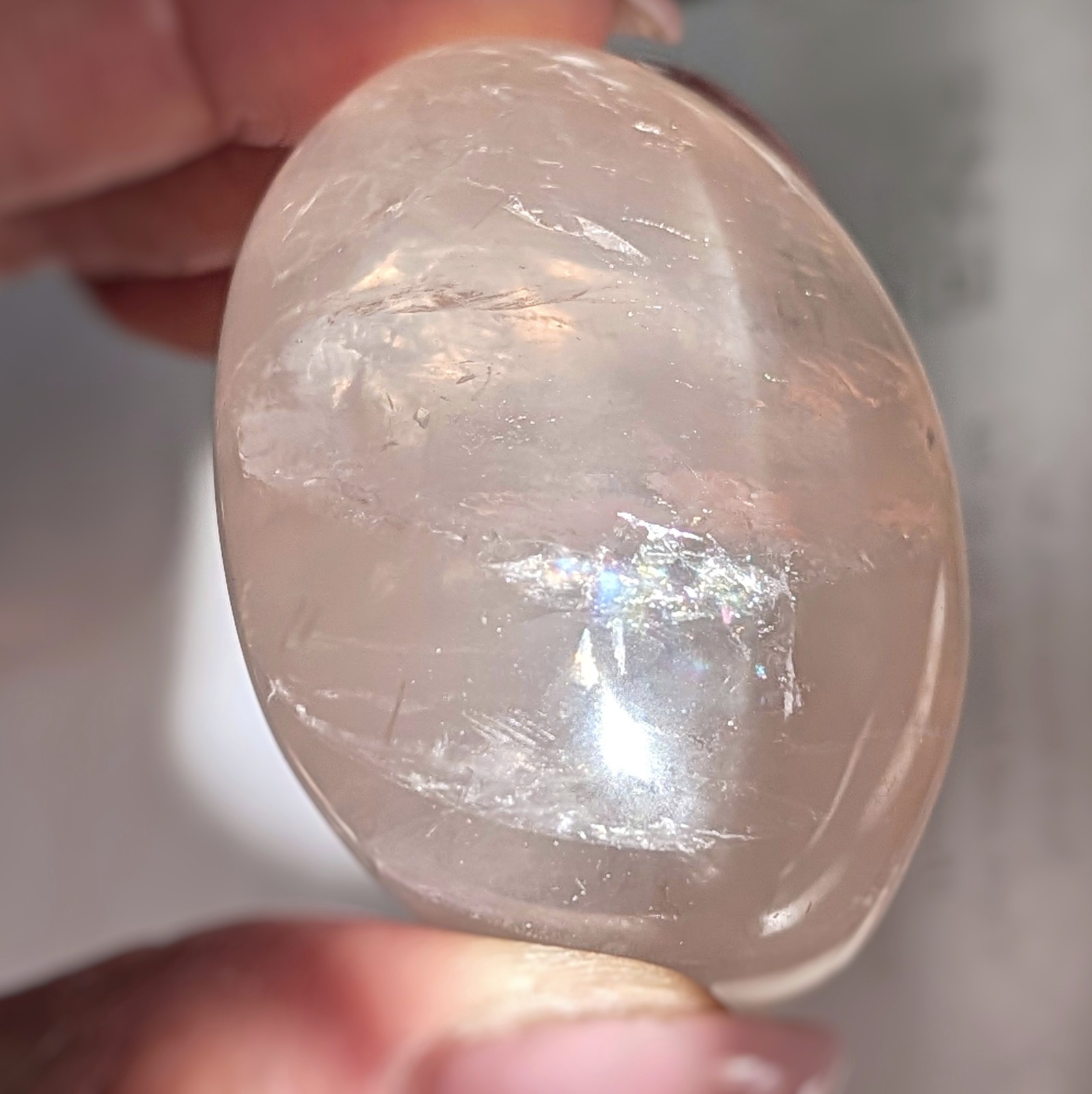 2″ translucent rose quartz palmstone with rainbow and asterism, star rose quartz